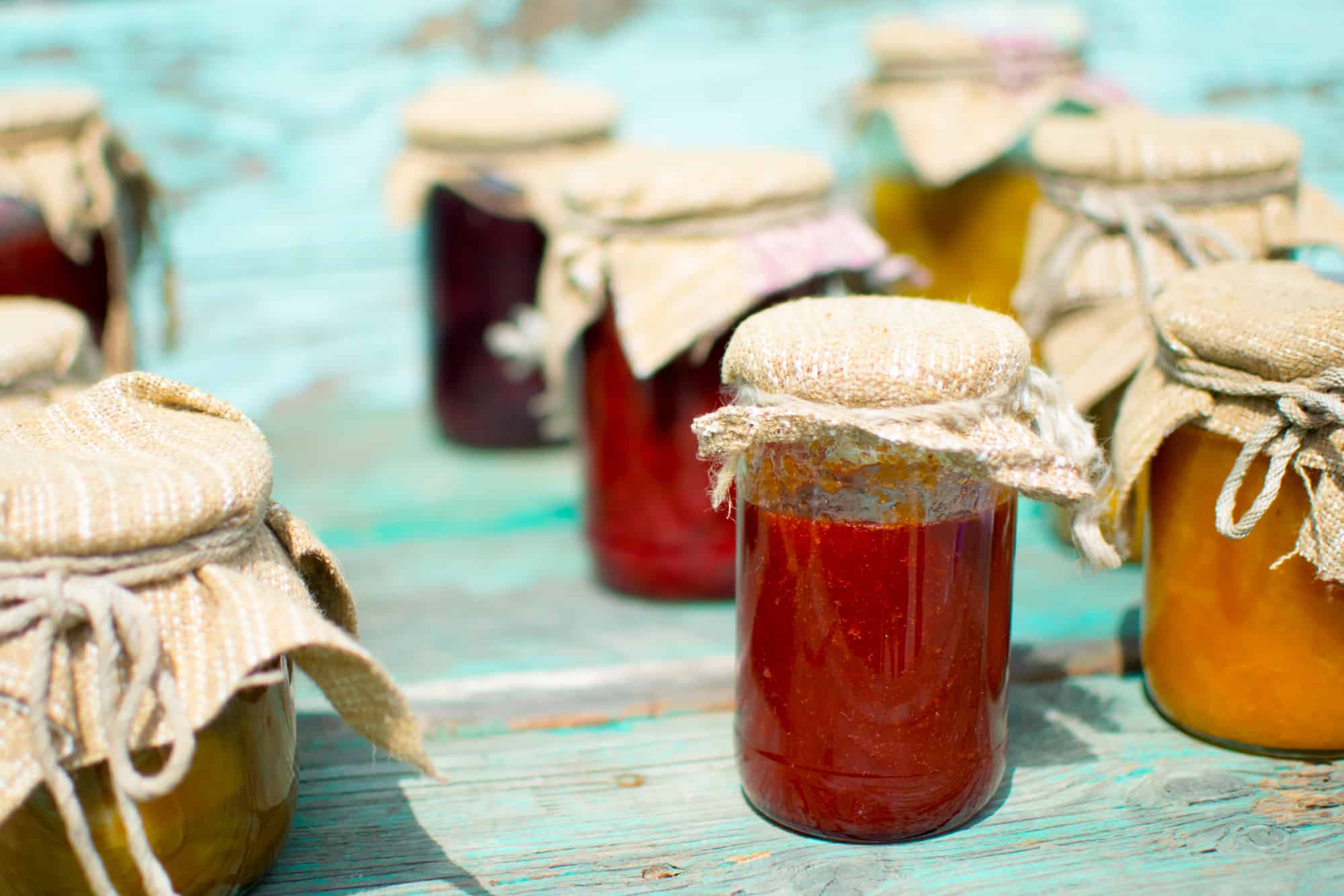 Several mason jars filled with fresh jam