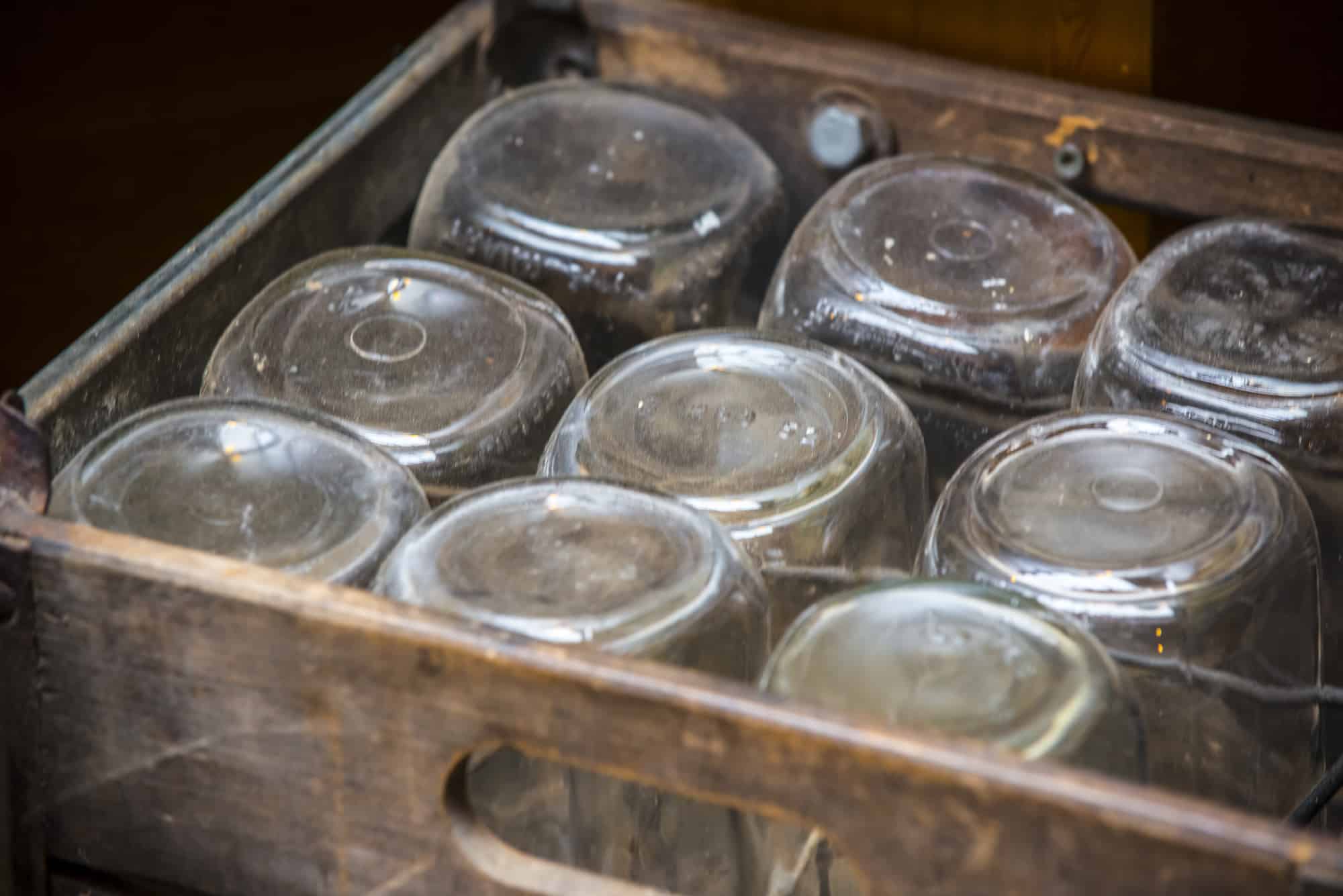 Rustic style wooden box with old fashion glass jars