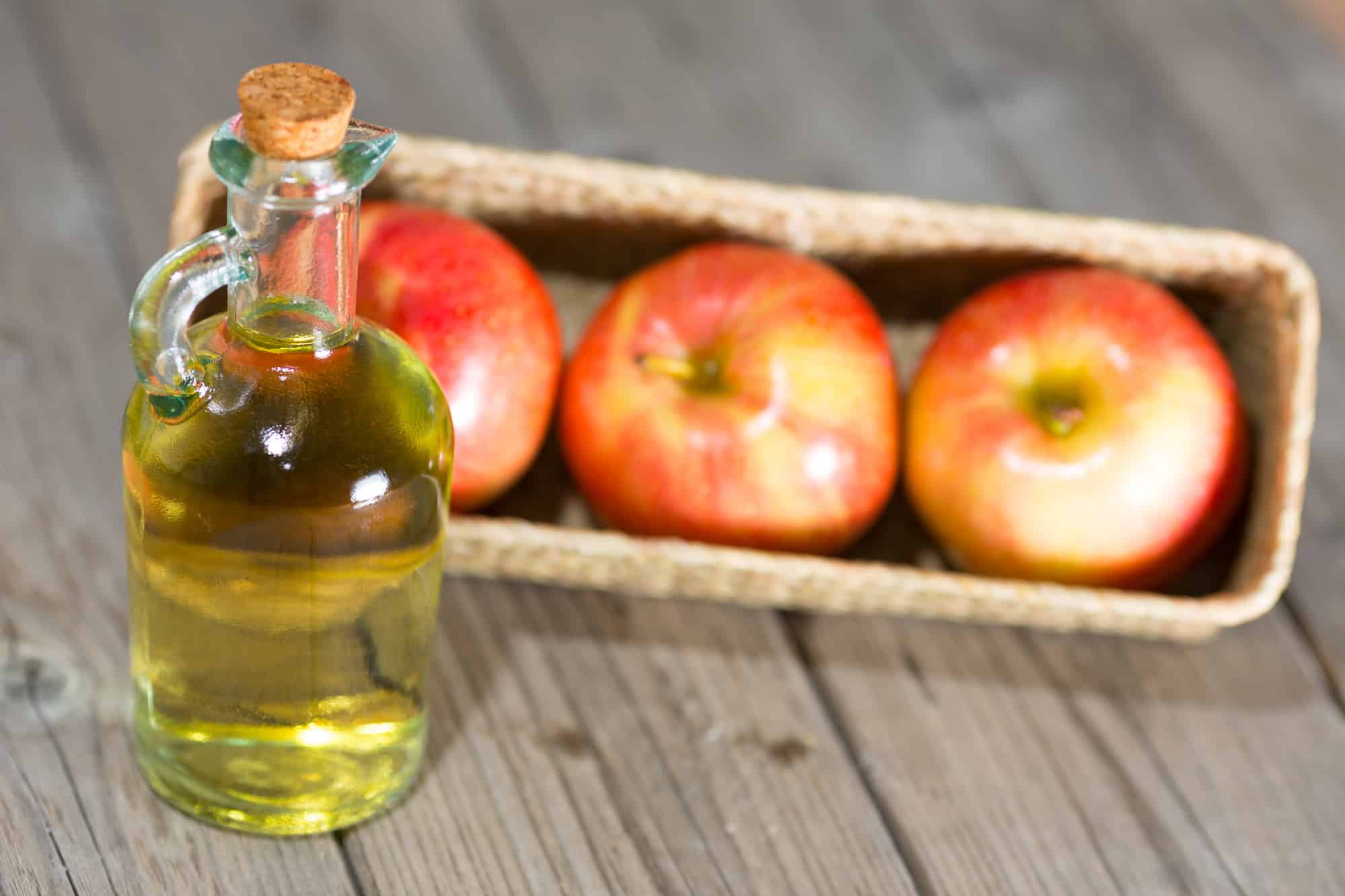 Homemade Vinegar galas apples on a table in a farmhouse