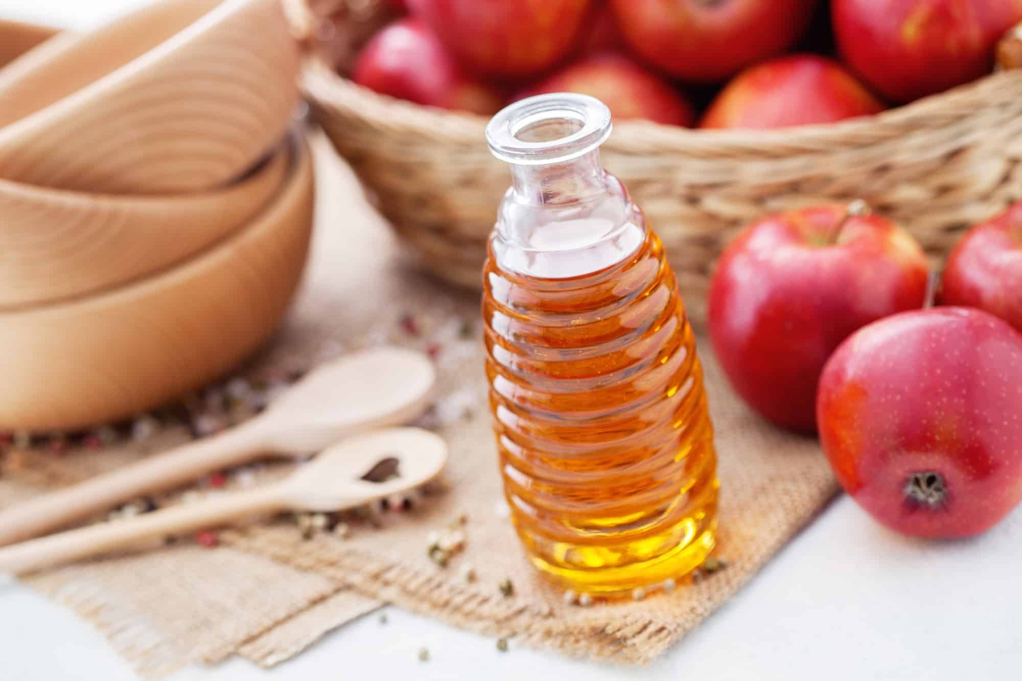 bottle of Apple cider vinegar with fresh fruits - food and drink