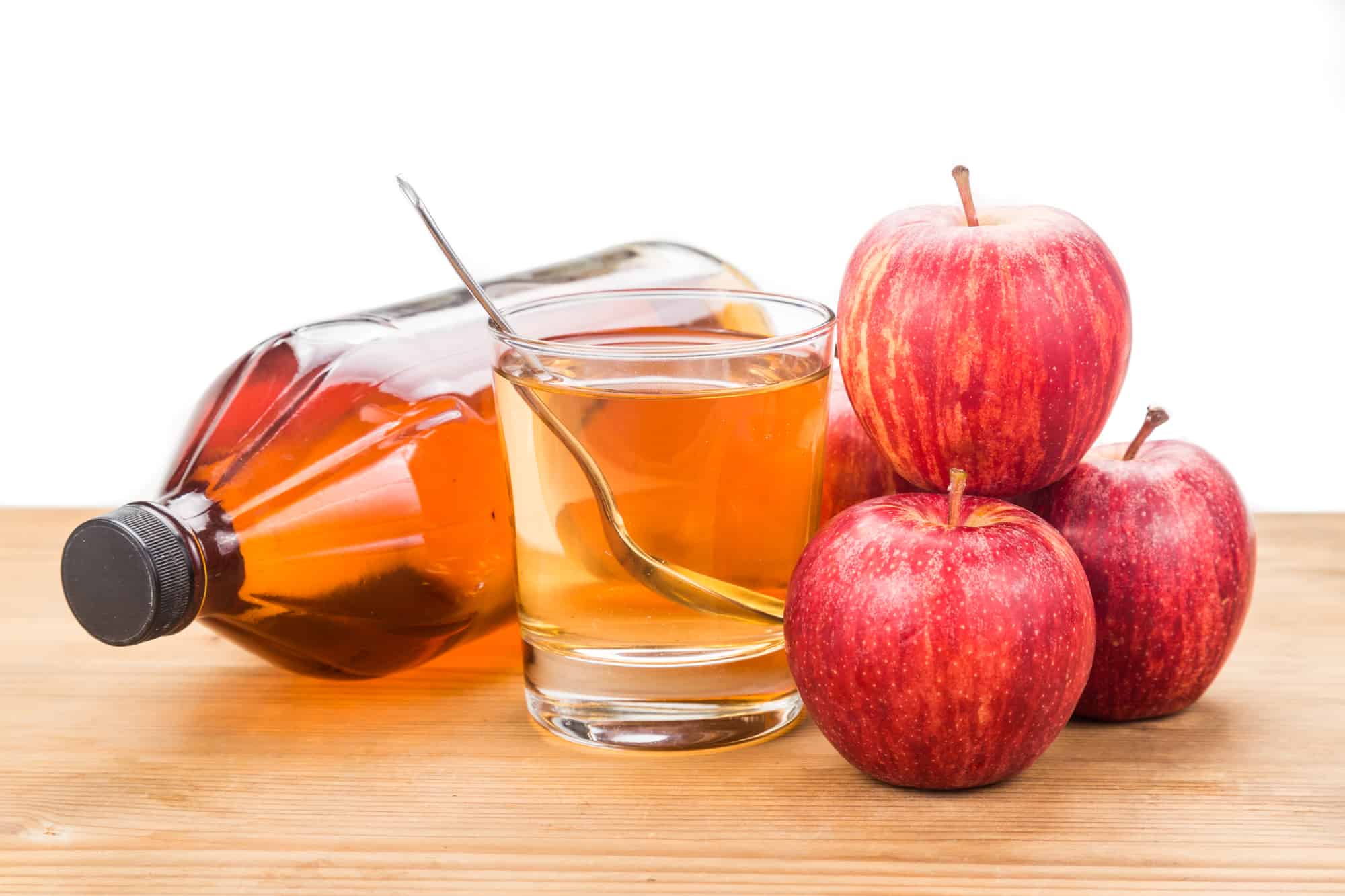 Apple cider vinegar in jar, glass and fresh apple, healthy drink.