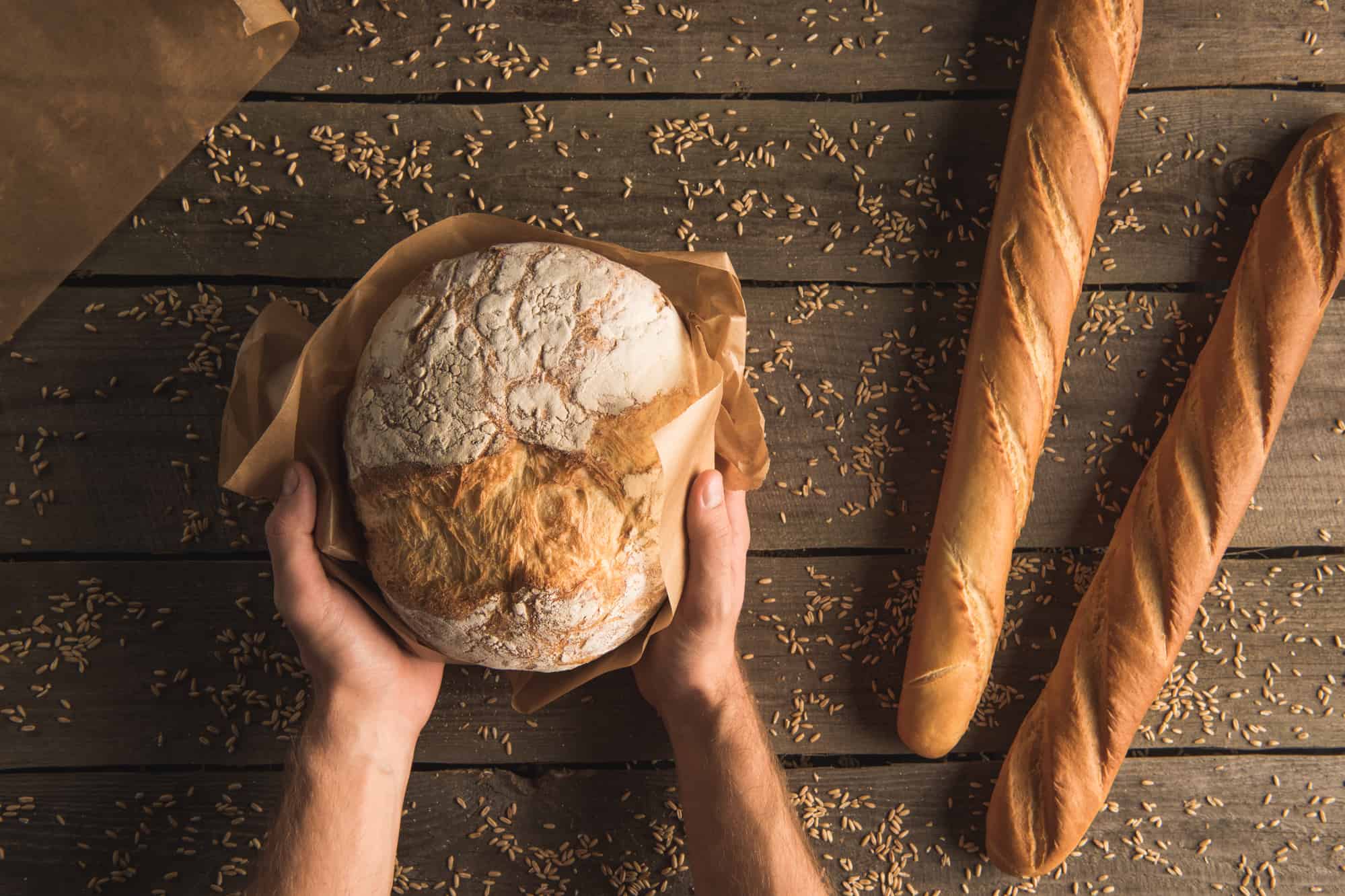 Freshly baked organic bread on a wooden table