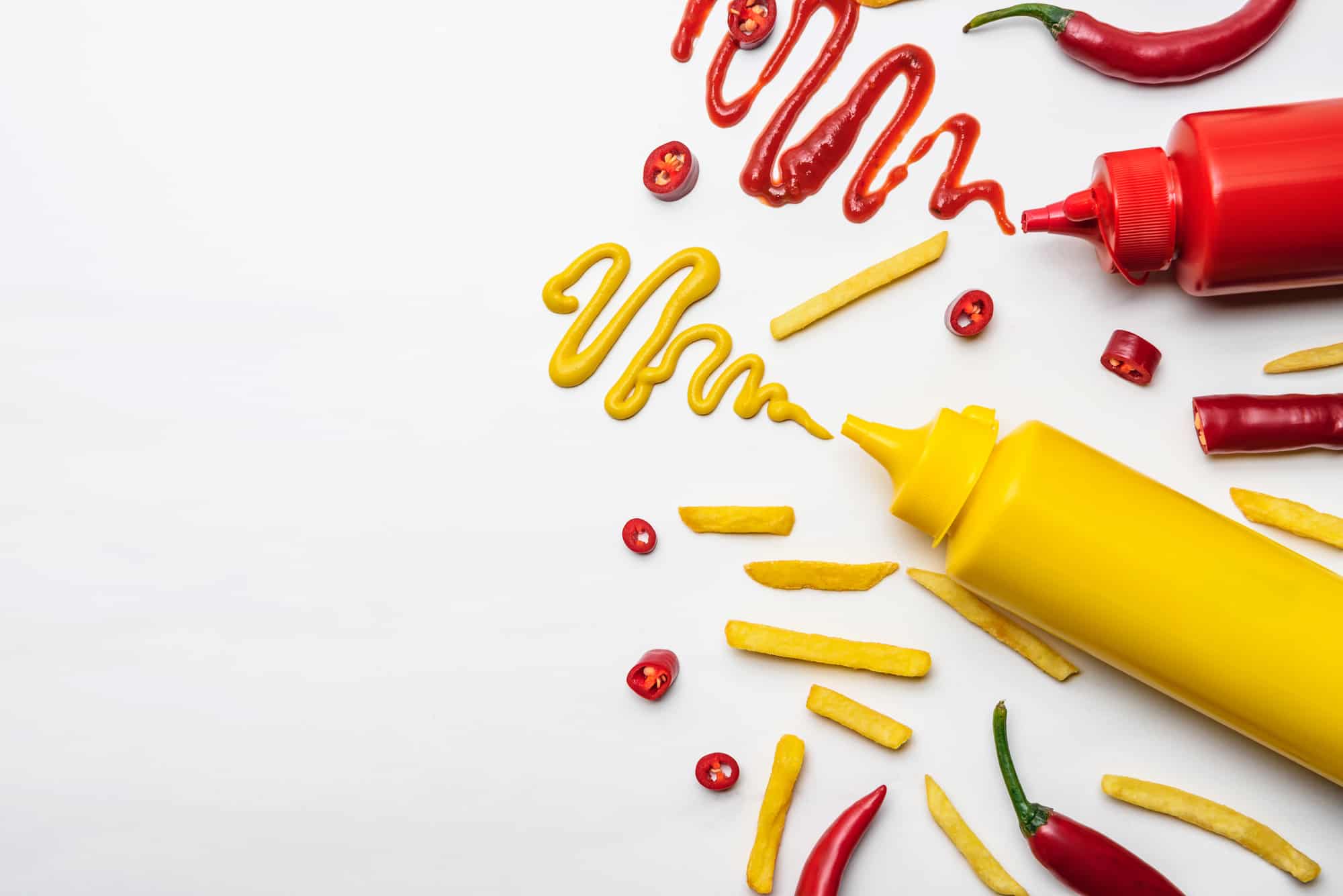 Ketchup and mustard squiggles on the table