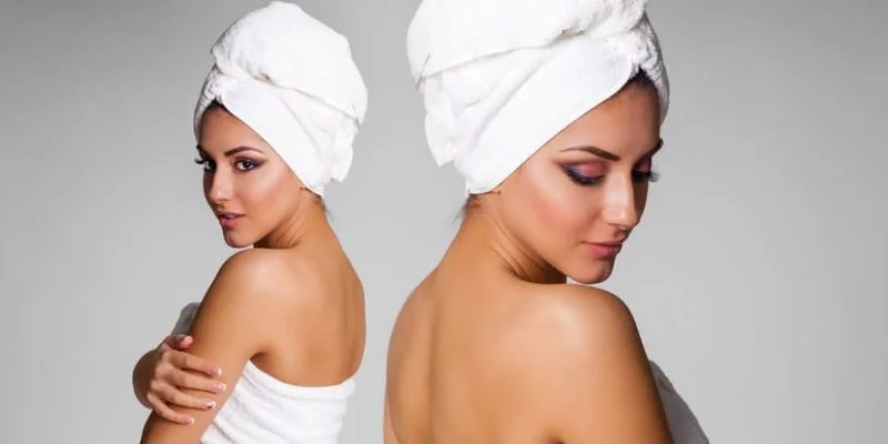 photo of woman with a bath towel wrapped around her hair
