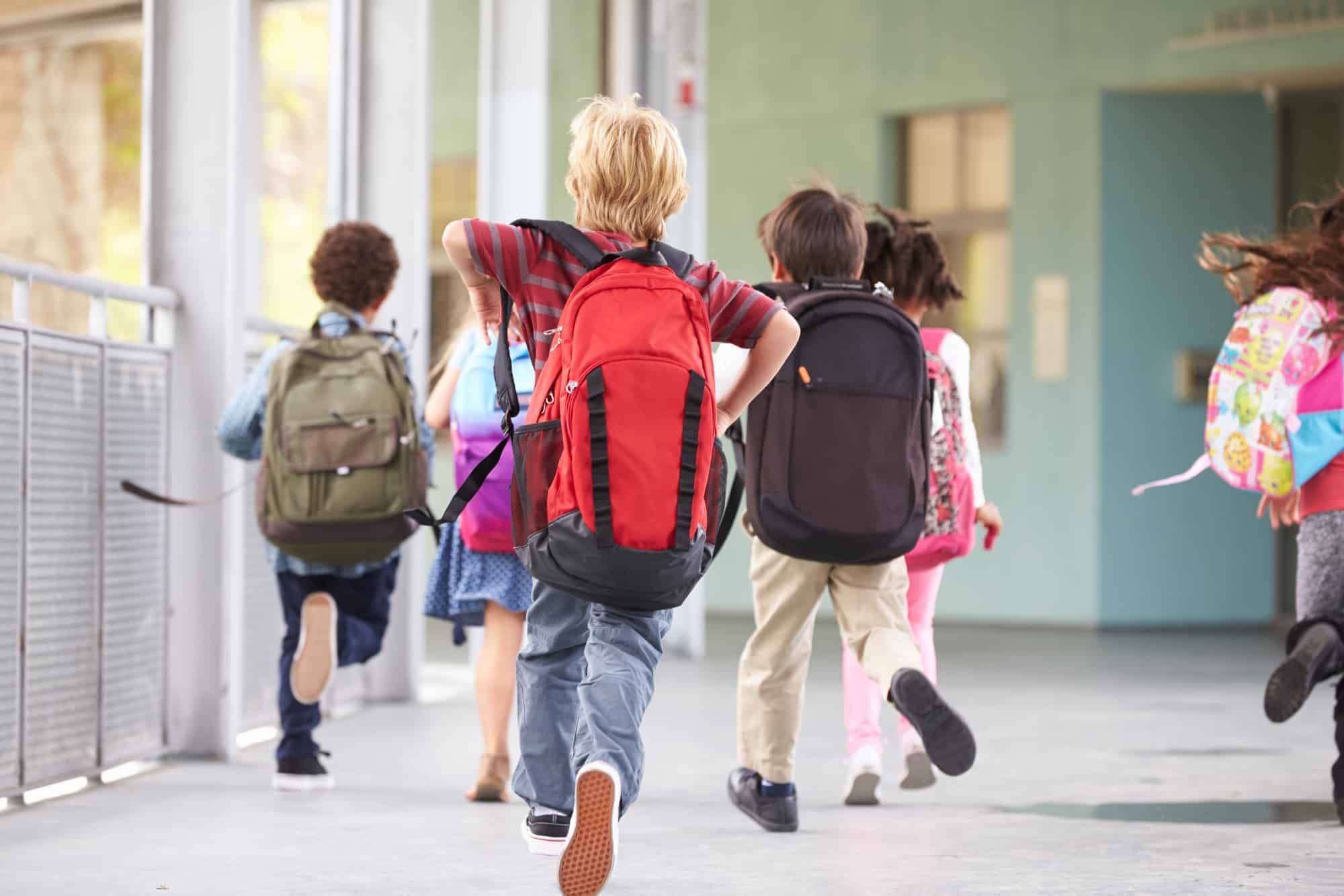 children running to class in elementary school