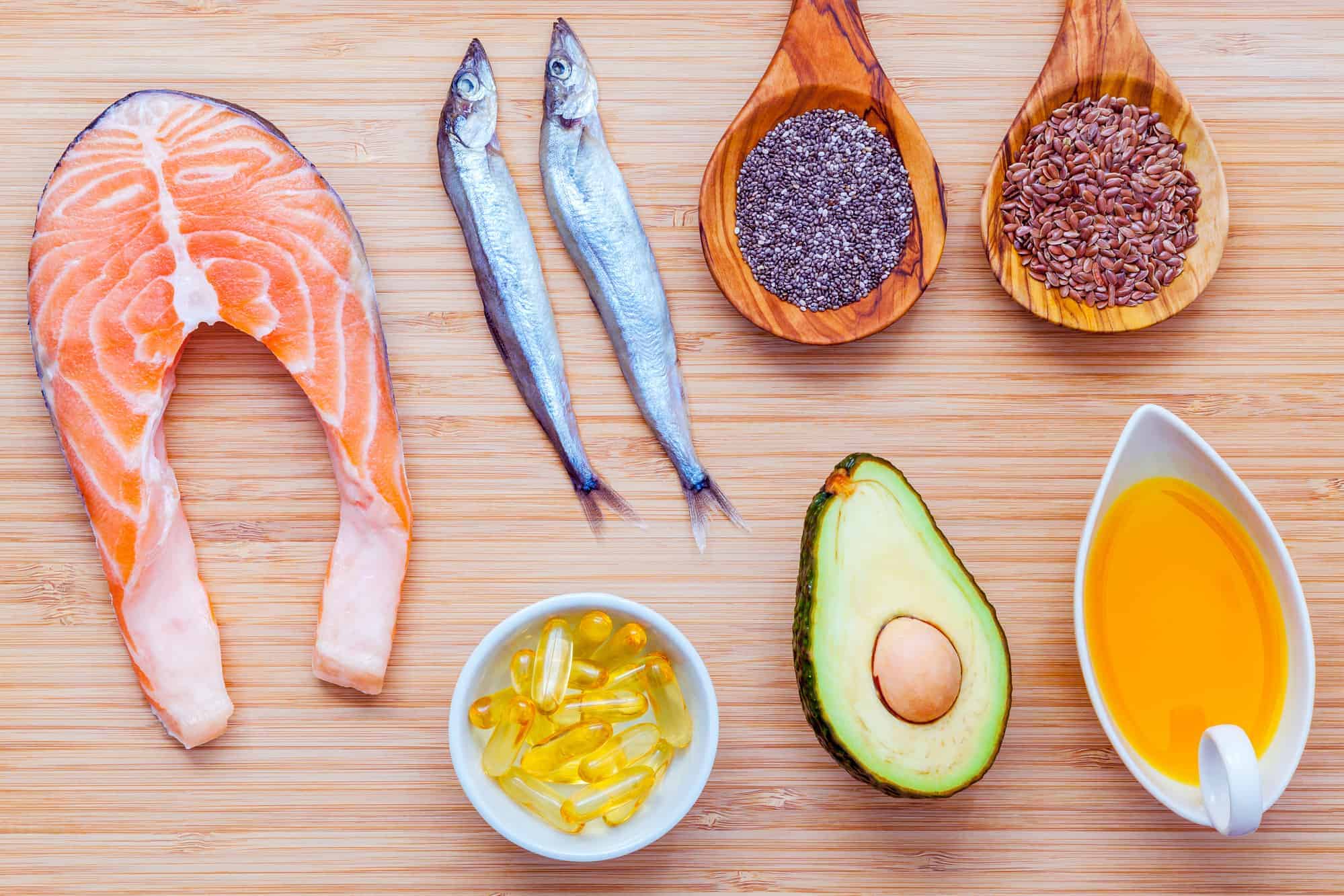 Selection of healthy fats on bamboo cutting board