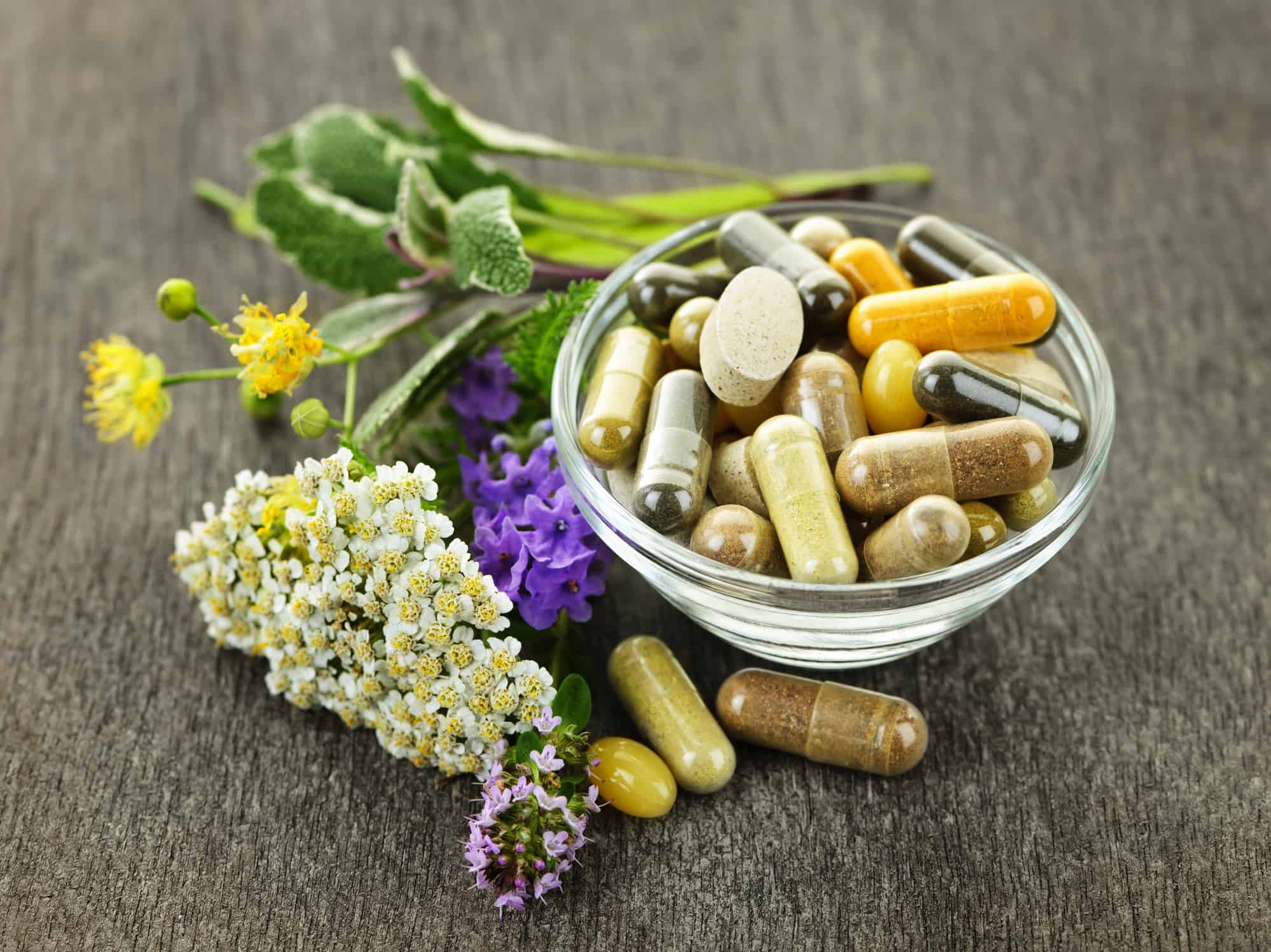 Herbs with alternative medicine herbal supplements and pills.