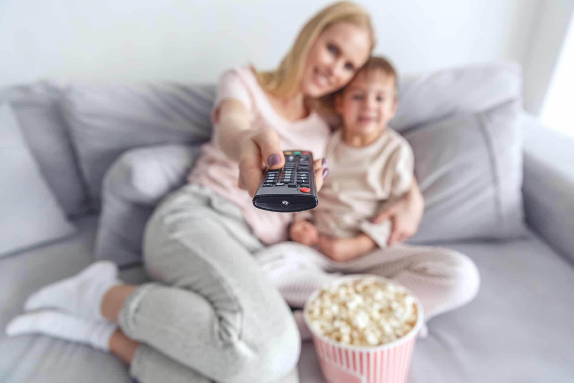 Mom and son watch television without knowledge of fire retardants inside