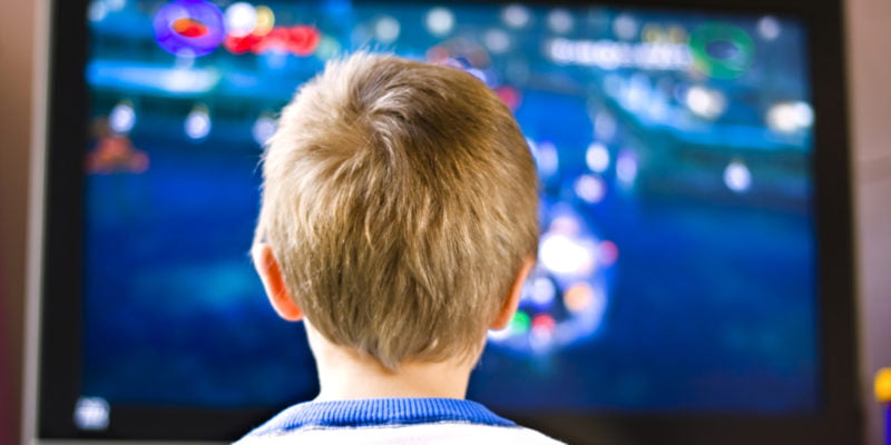 child sitting in front of toxic american television with fire retardants