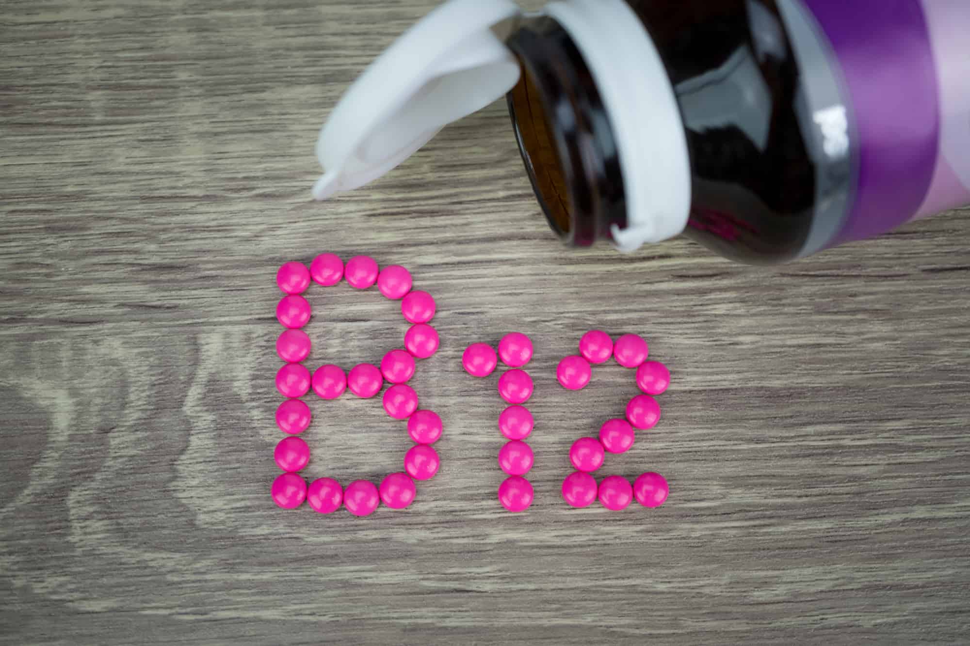 Pink pills forming shape to B12 alphabet