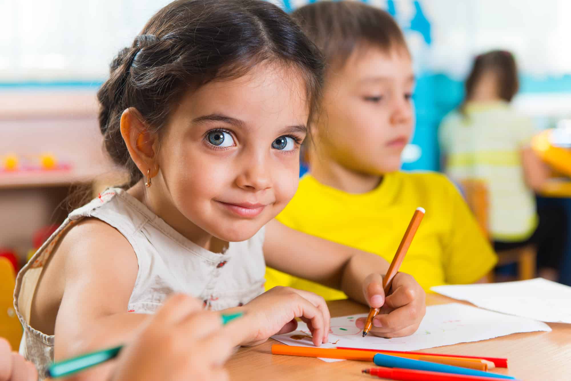 pretty young girl in school with green eyes