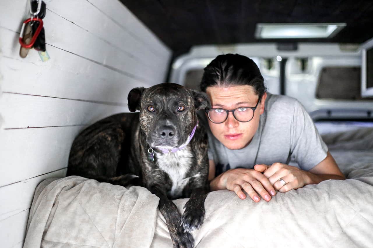 Vanlife: Ashlee Rowlands husband and dog in their sustainable van sleeping quarters