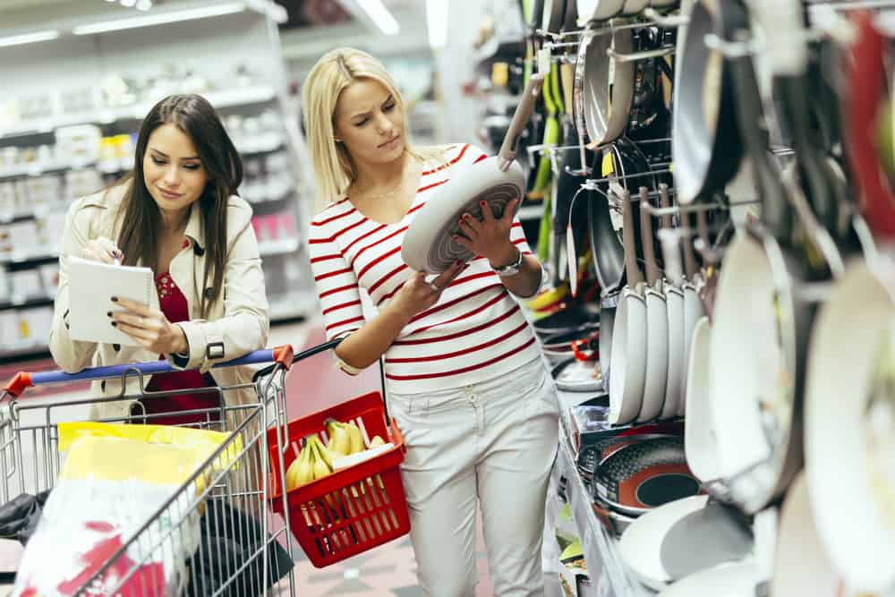 Women shopping for cookware in the supermarket