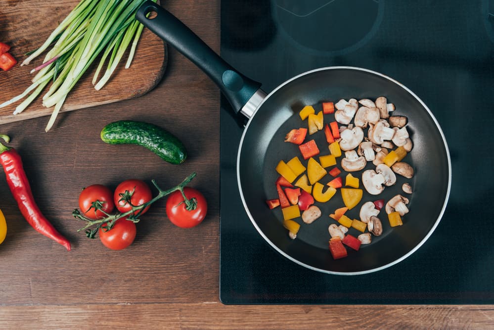 ceramic cookware sauteing carrots & mushrooms