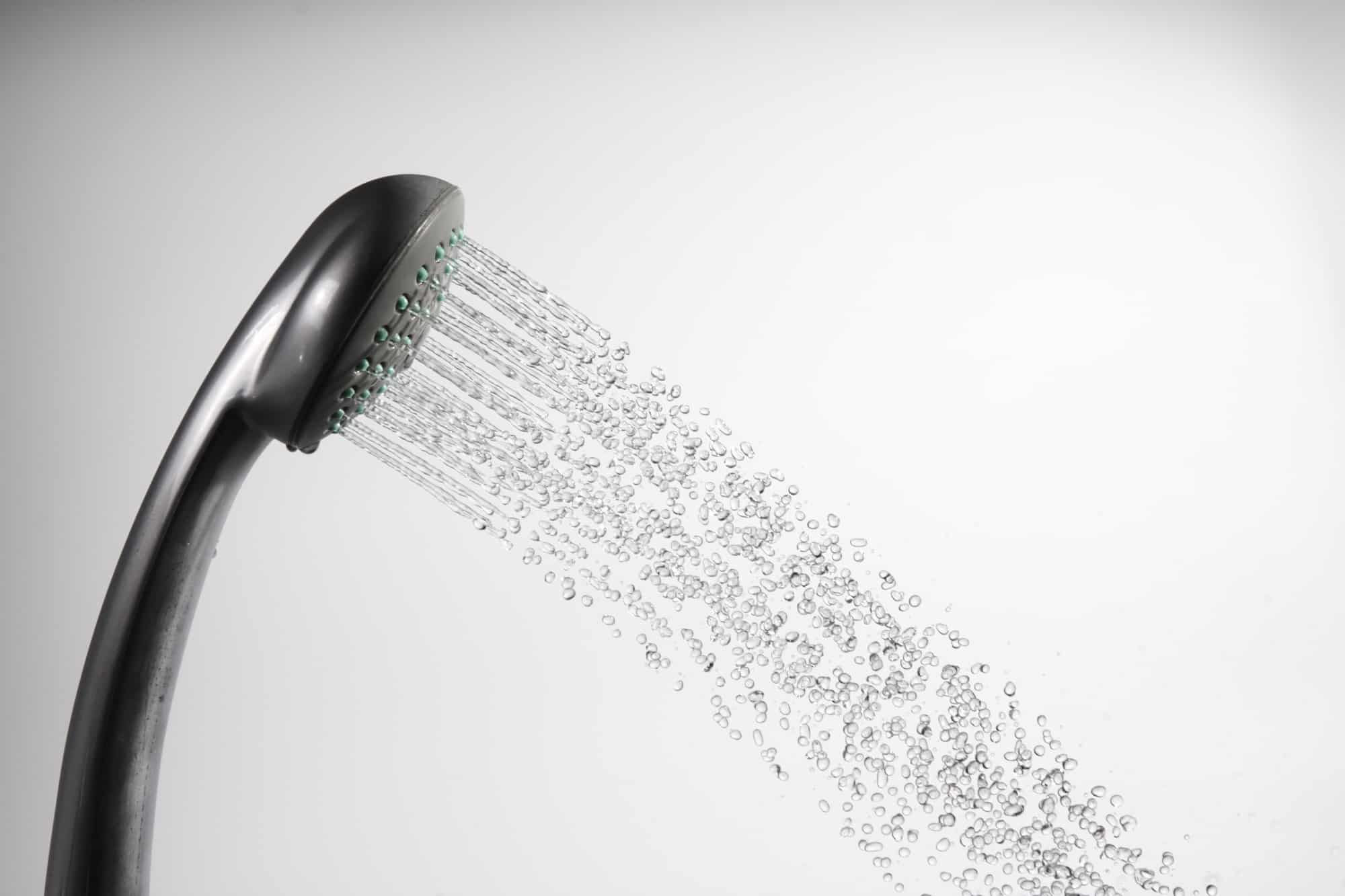 A shower head is spraying water