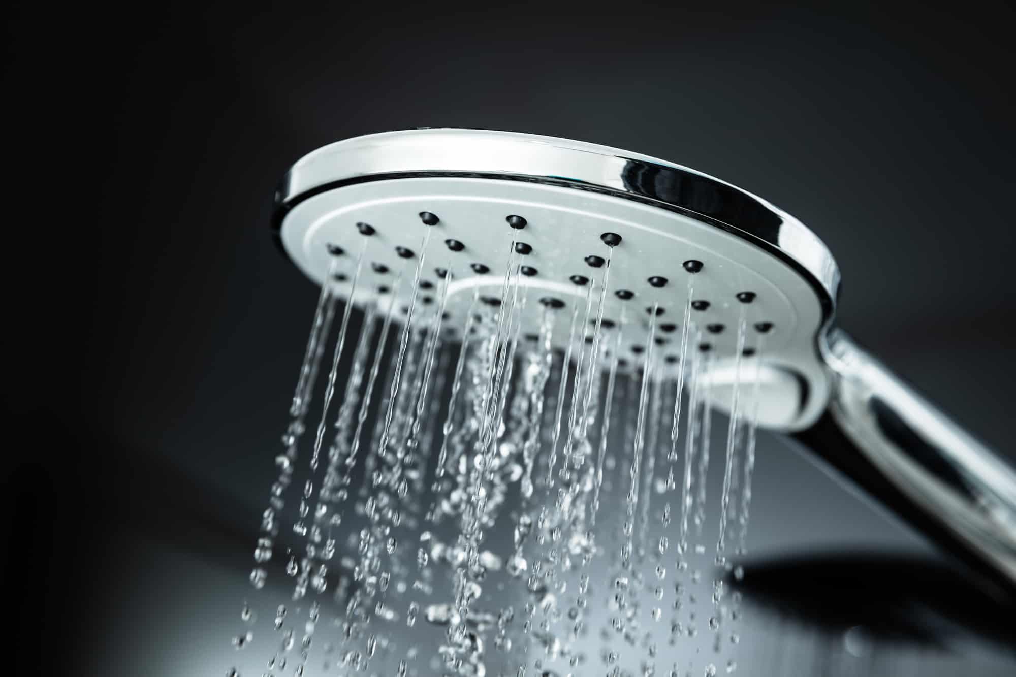 Close-up Of Water Flowing From Shower In The Bathroom