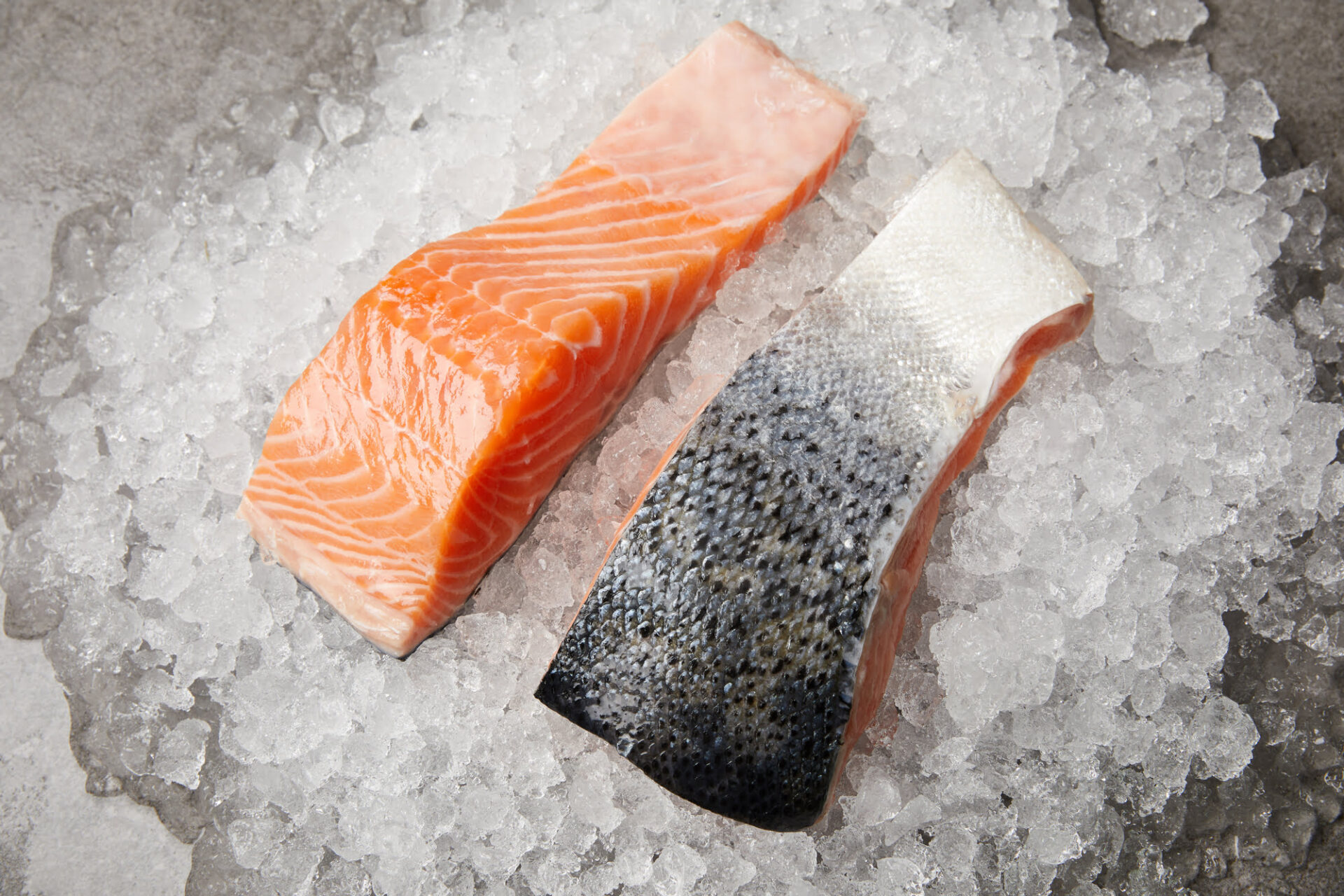 Slice Of Raw Pink Salmon Steak For Restaurant Menu Close Up On Natural  Black Stone Background. Thick Piece Of Fresh Red Fish, Chum Or Trout Stock  Photo, Picture and Royalty Free Image.