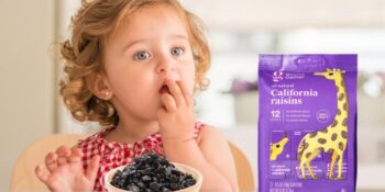 Child eating good and gather raisins from target