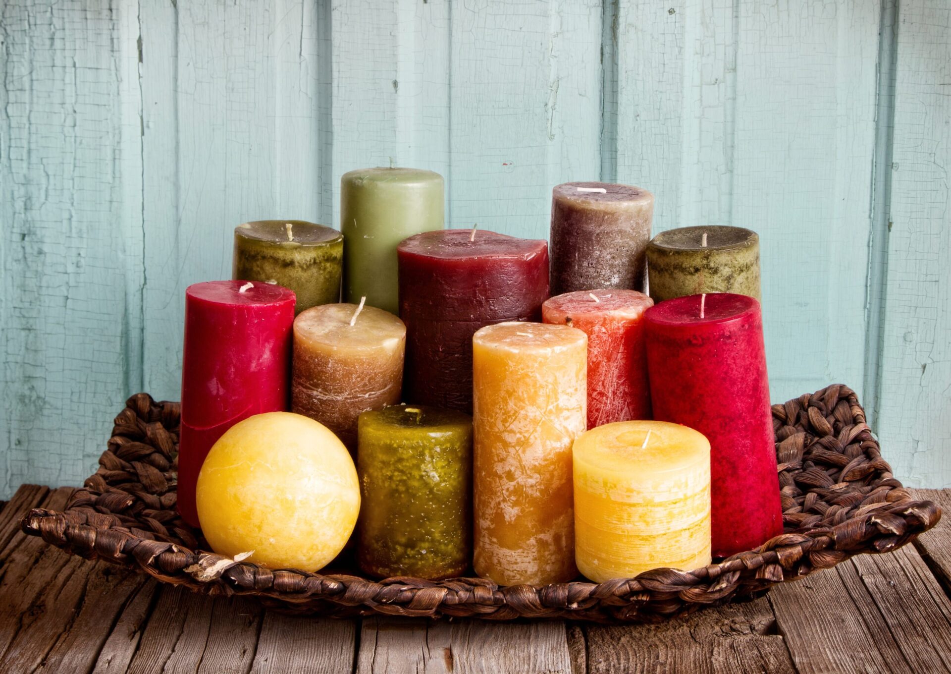 collection of decoratice candles on a rustic antique wooden