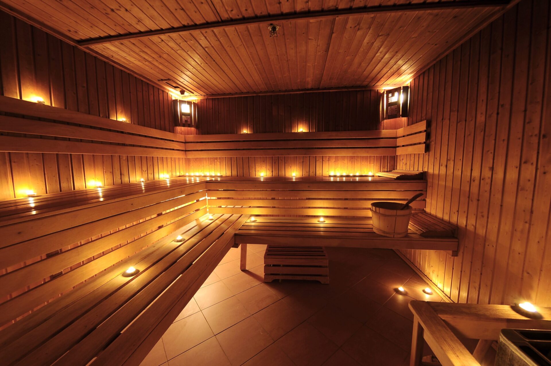 Warm finnish sauna interior with candles