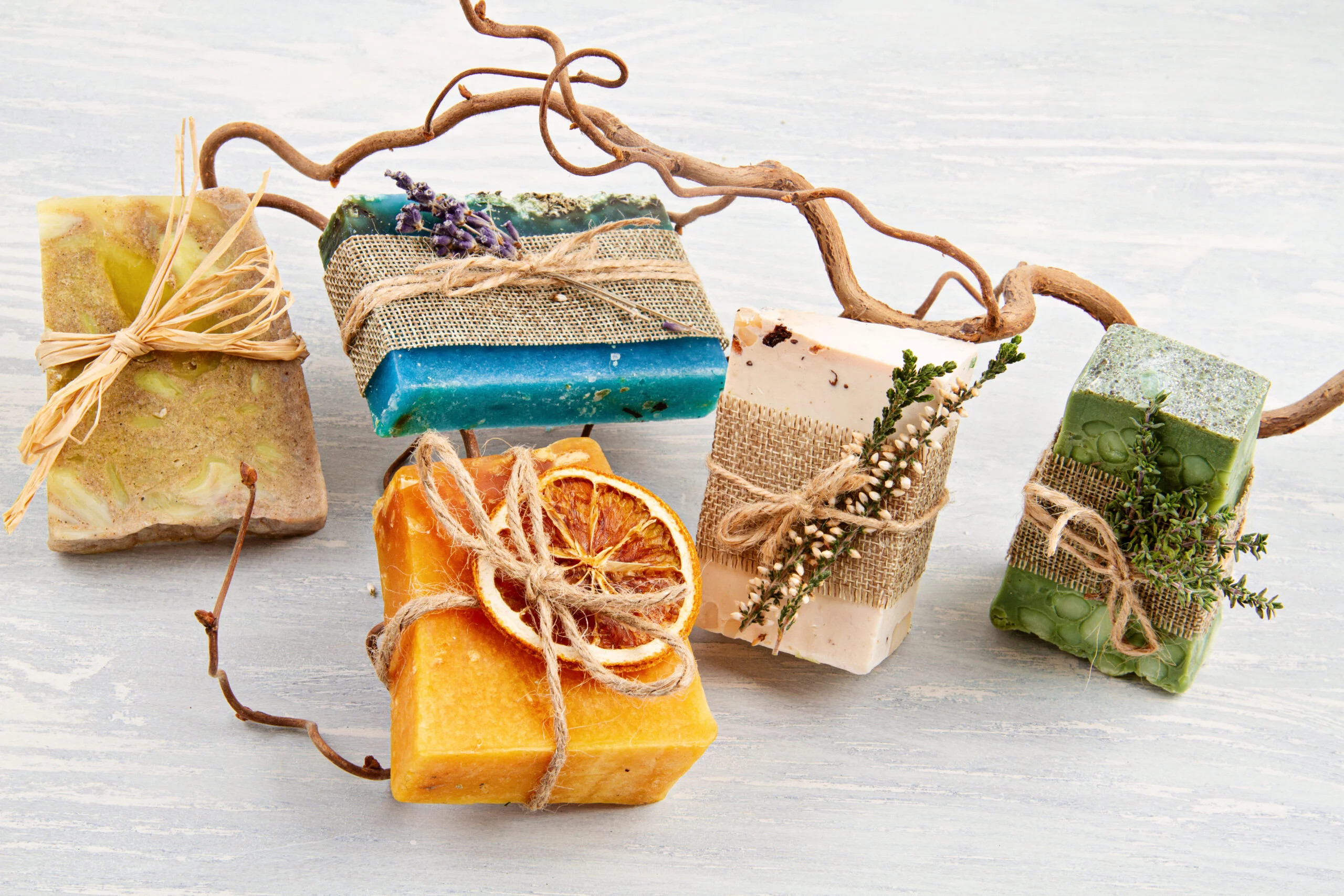 Handmade natural soap, eco friendly spa, beauty skincare concept. Small business, ethical shopping idea. Soap and dry shampoo bars packed in plastic free, natural gift wrap
