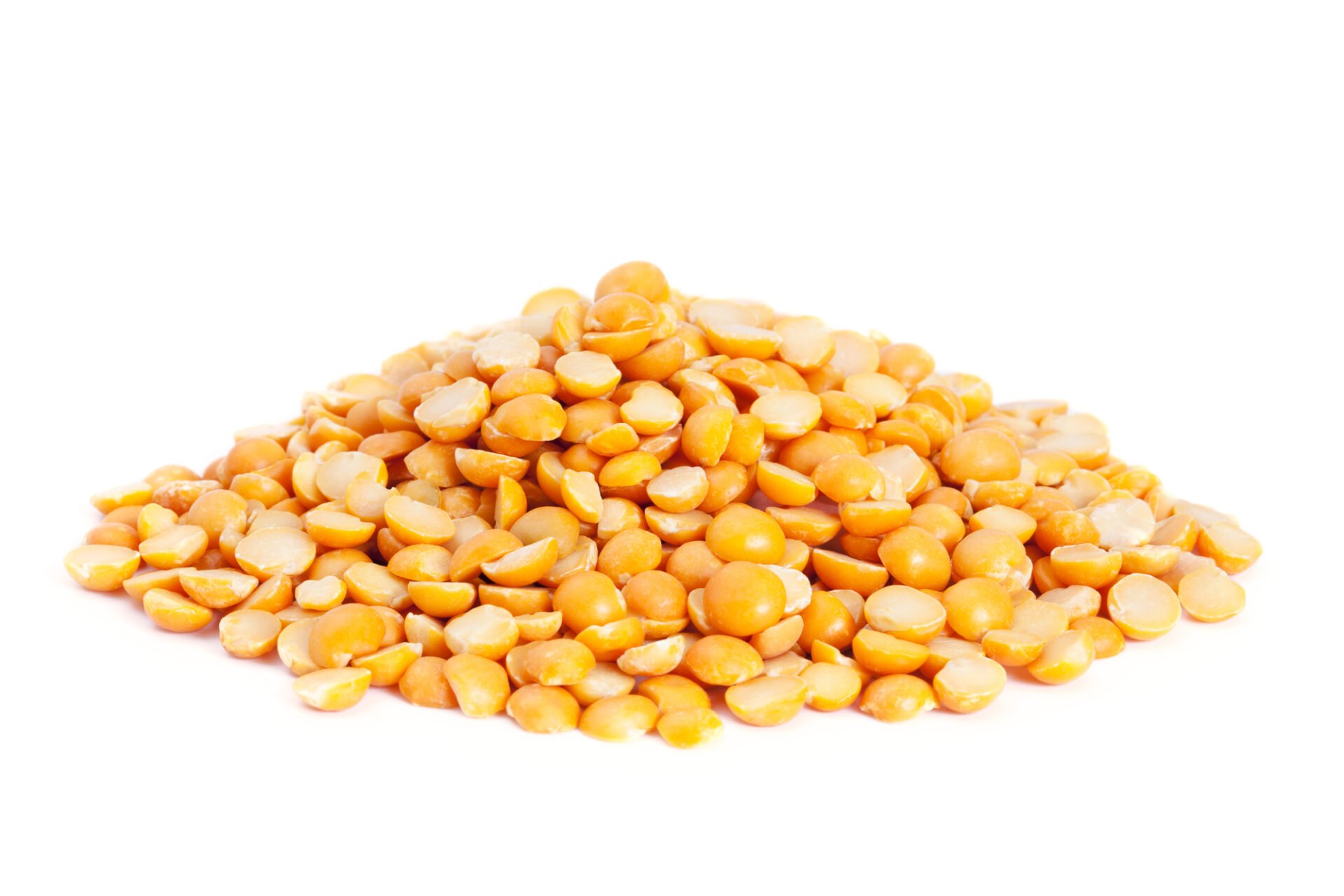 Pile dry split yellow peas isolated on white background