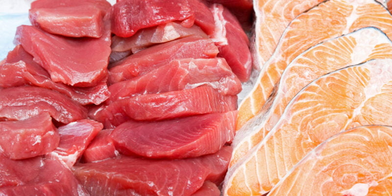 Bunch of fresh tuna steaks and salmon cutlets