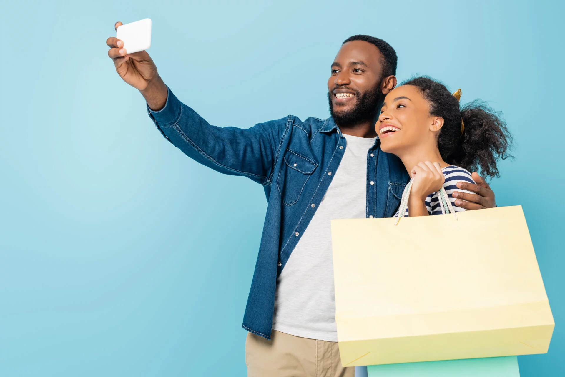 black man and woman shopping and taking selfie
