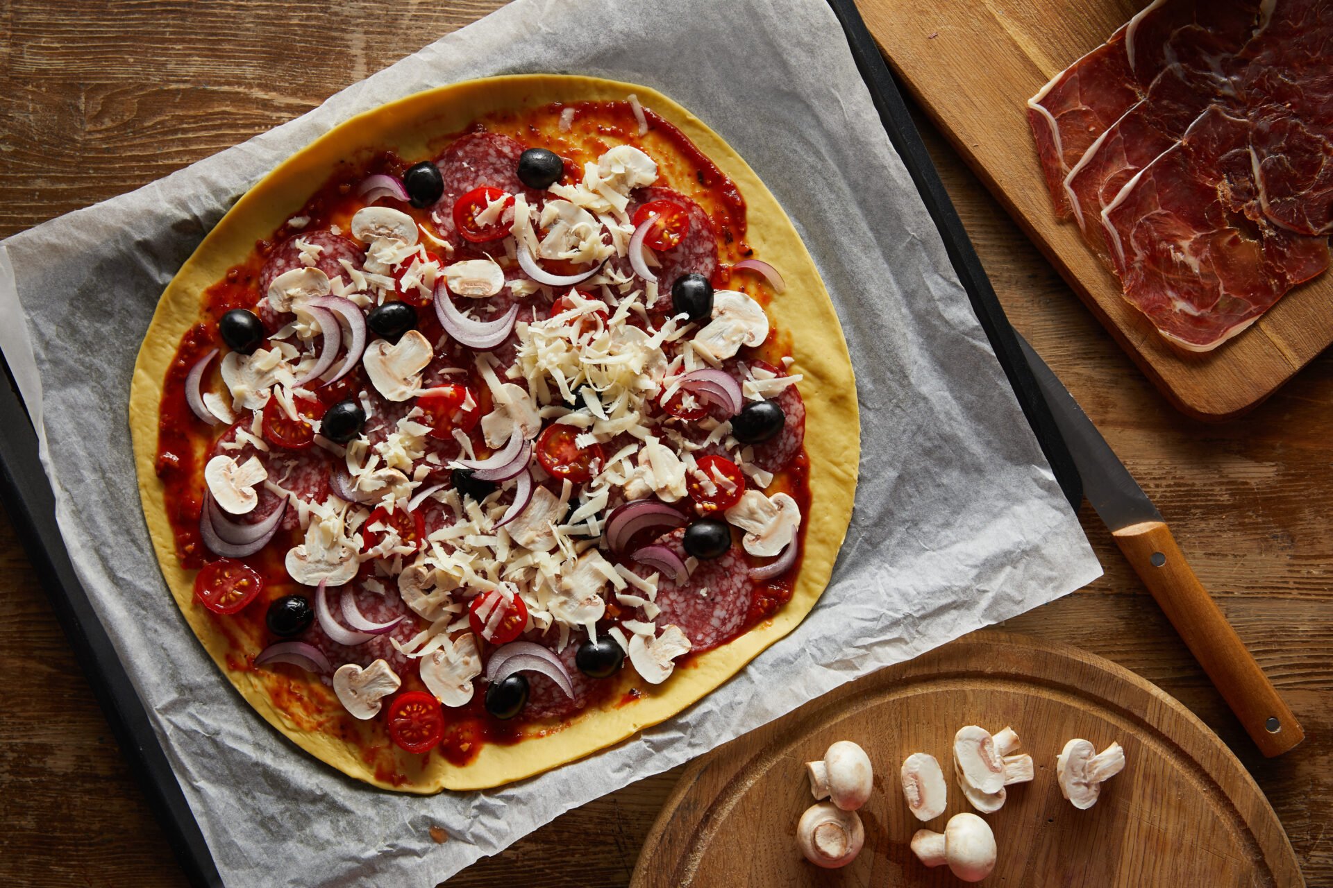 homemade pizza on parchment paper