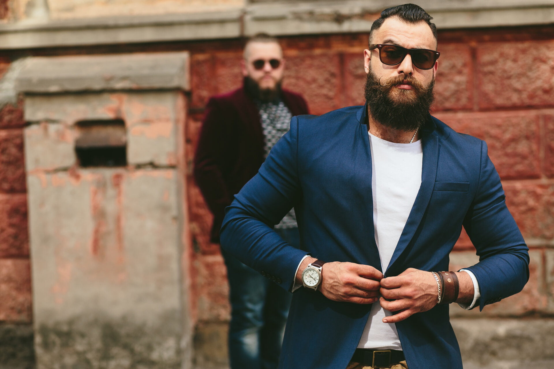 Two stylish bearded men on the background of the old town