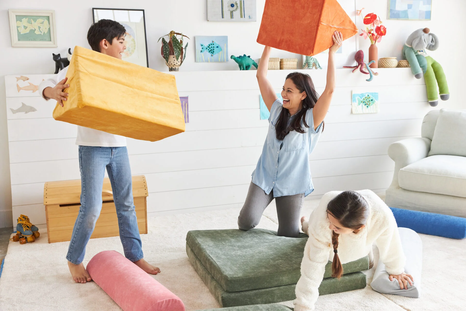 mom and young adolescents playing with modular foam play couch