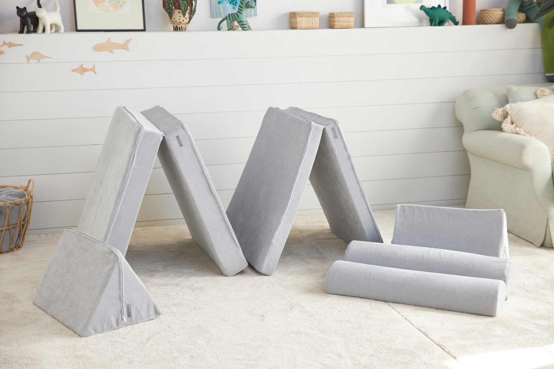 gray foam modular play couches in a living room
