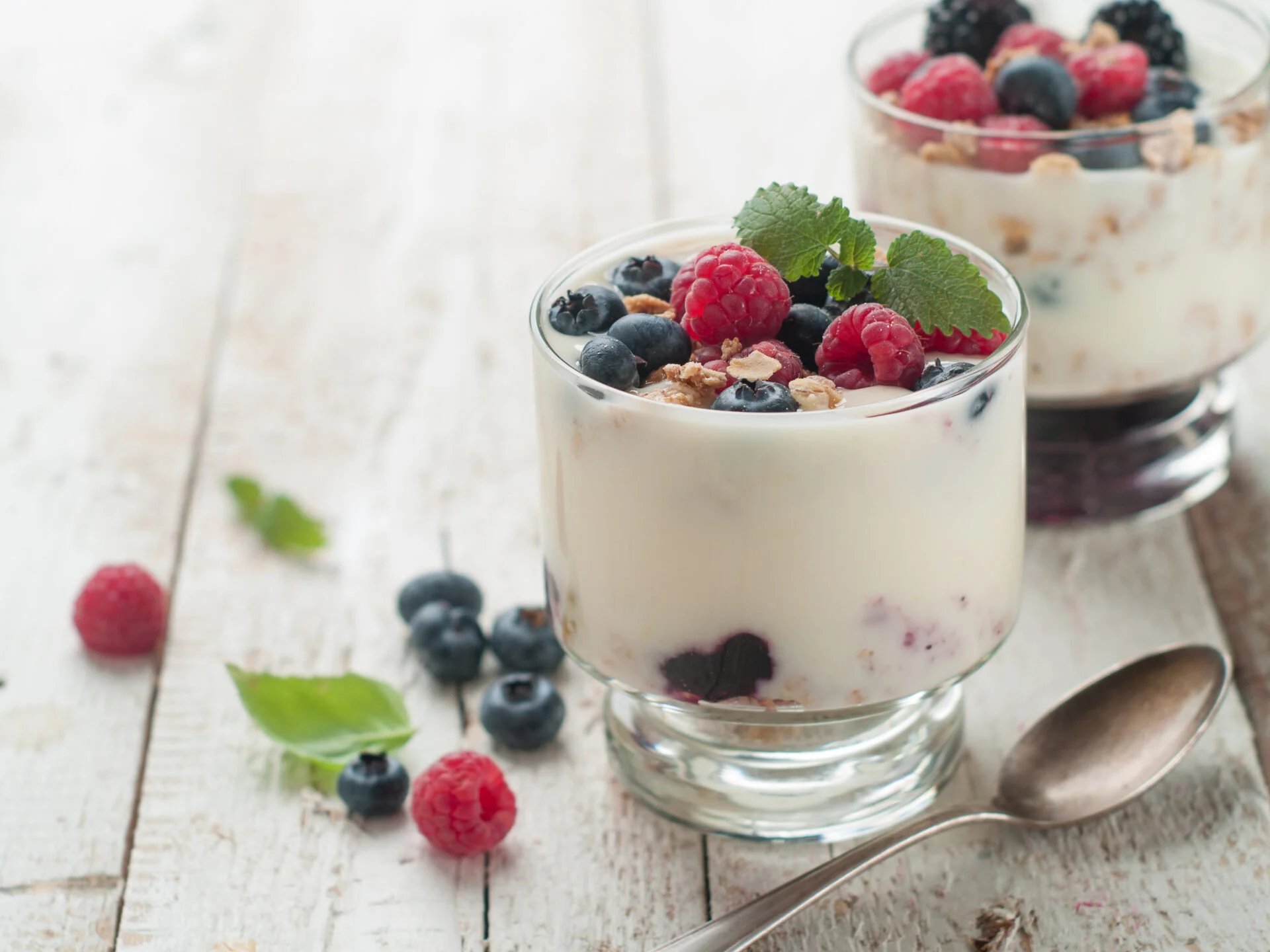 Yogurt with granola or muesli and fresh berries for healthy morning meal