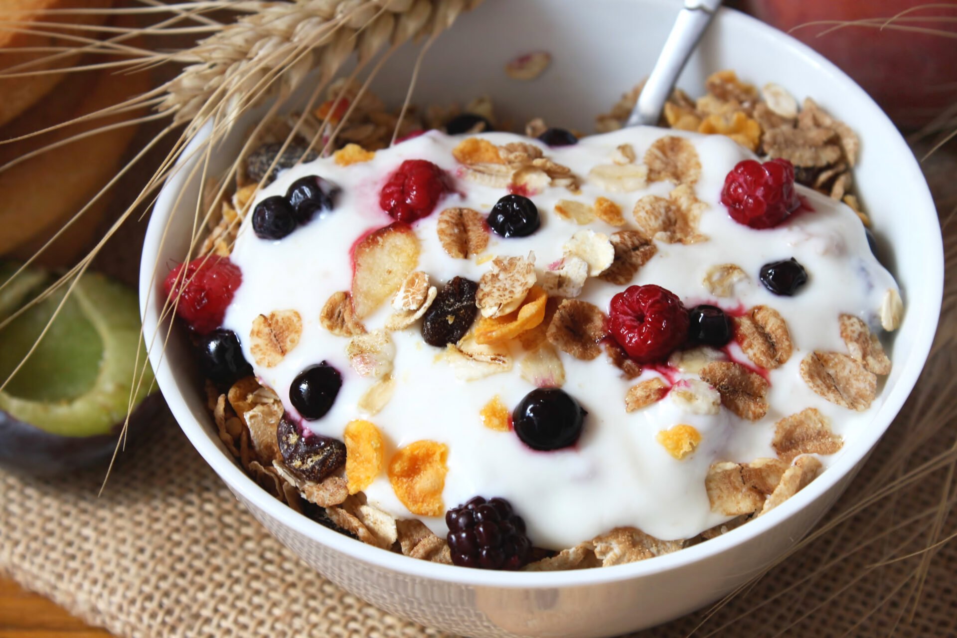 bowl of muesli with raisins,yogurt and berry fruits,healthy breakfast rich in fiber