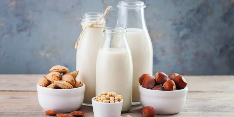 dairy free milk drink and ingredients for breakfast - food and drink