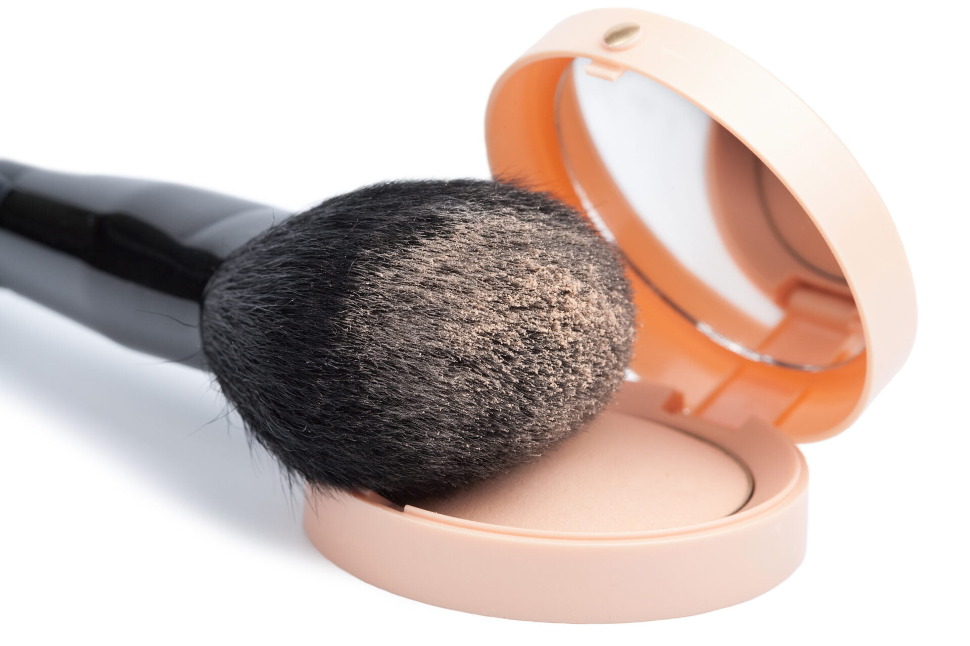 compact powder and black brush isolated
