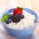 Close-up of homemade cottage cheese with strawberry, blueberries and blackberry