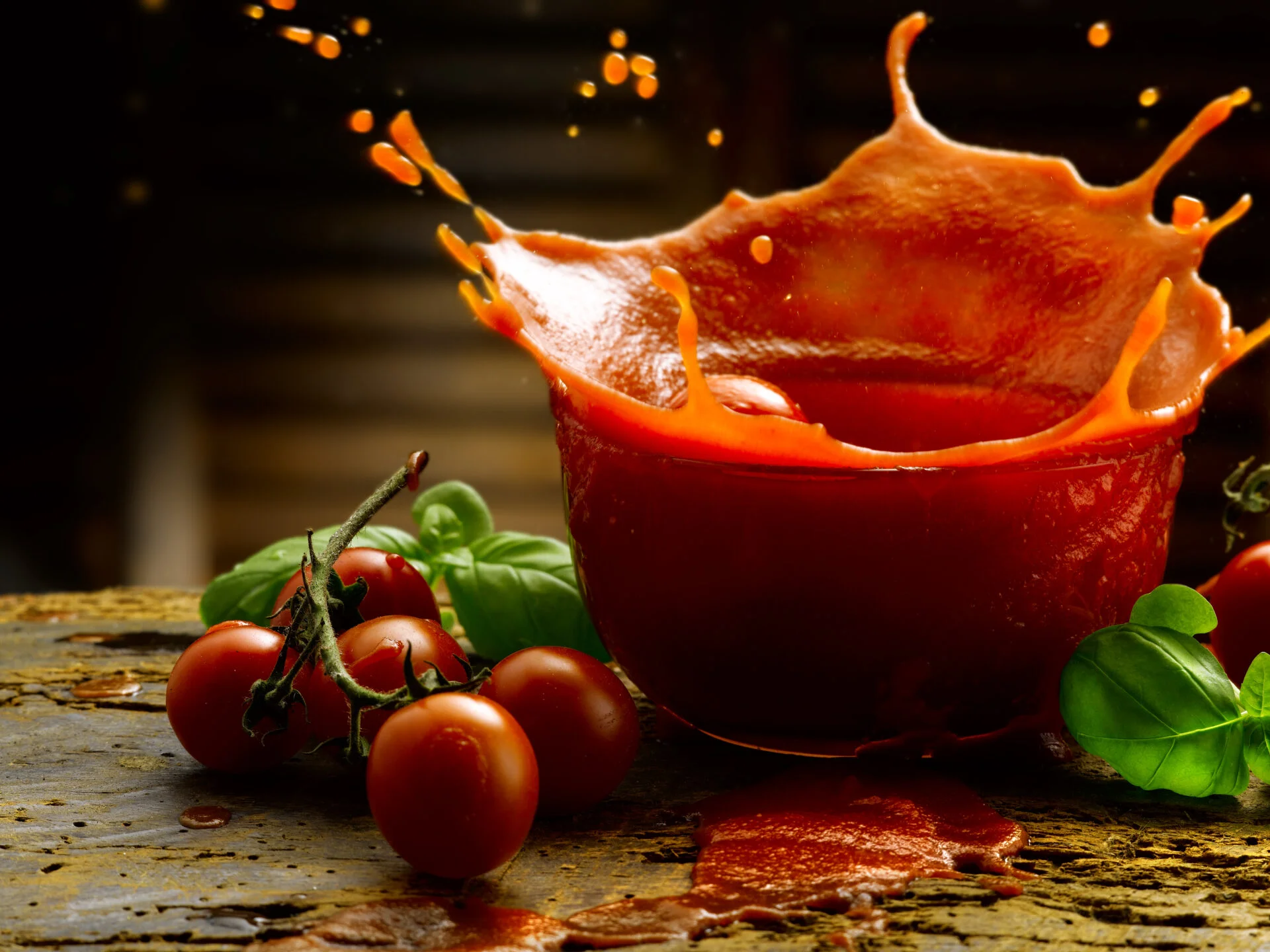 Tomato sauce on table with tomato splash