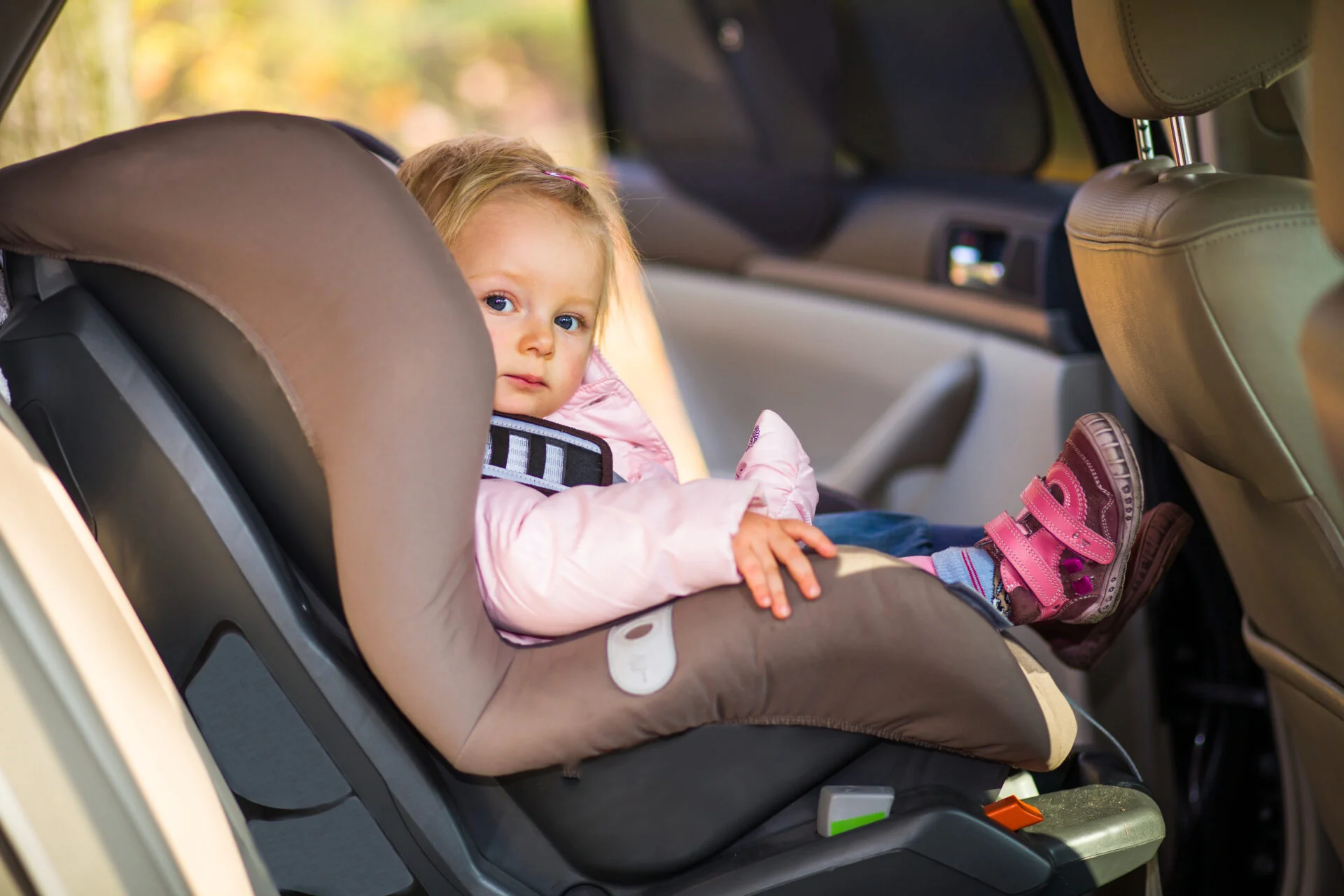 baby girl in safe non-toxic car seat