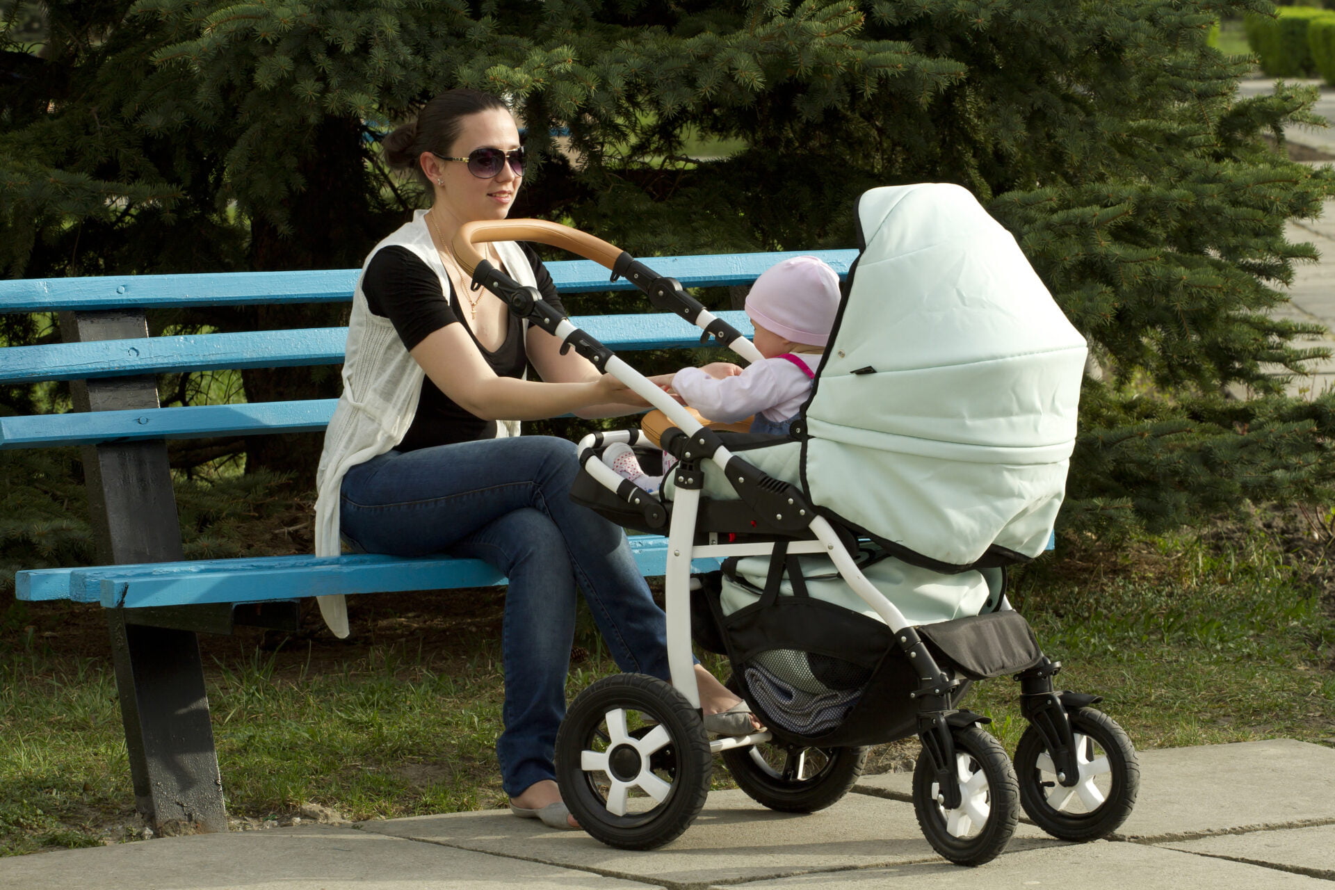 Mom in park with her baby in a non-toxic stroller