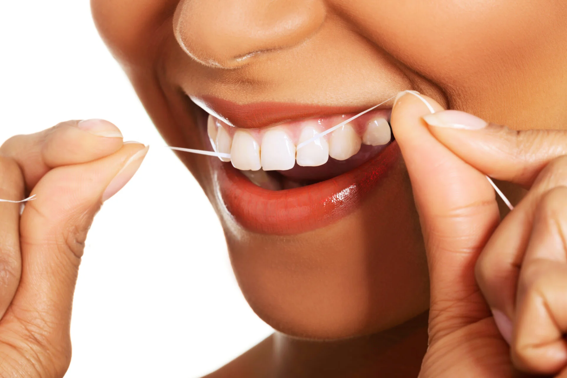 Attractive woman with dental floss. Closeup. Mouth and teeth