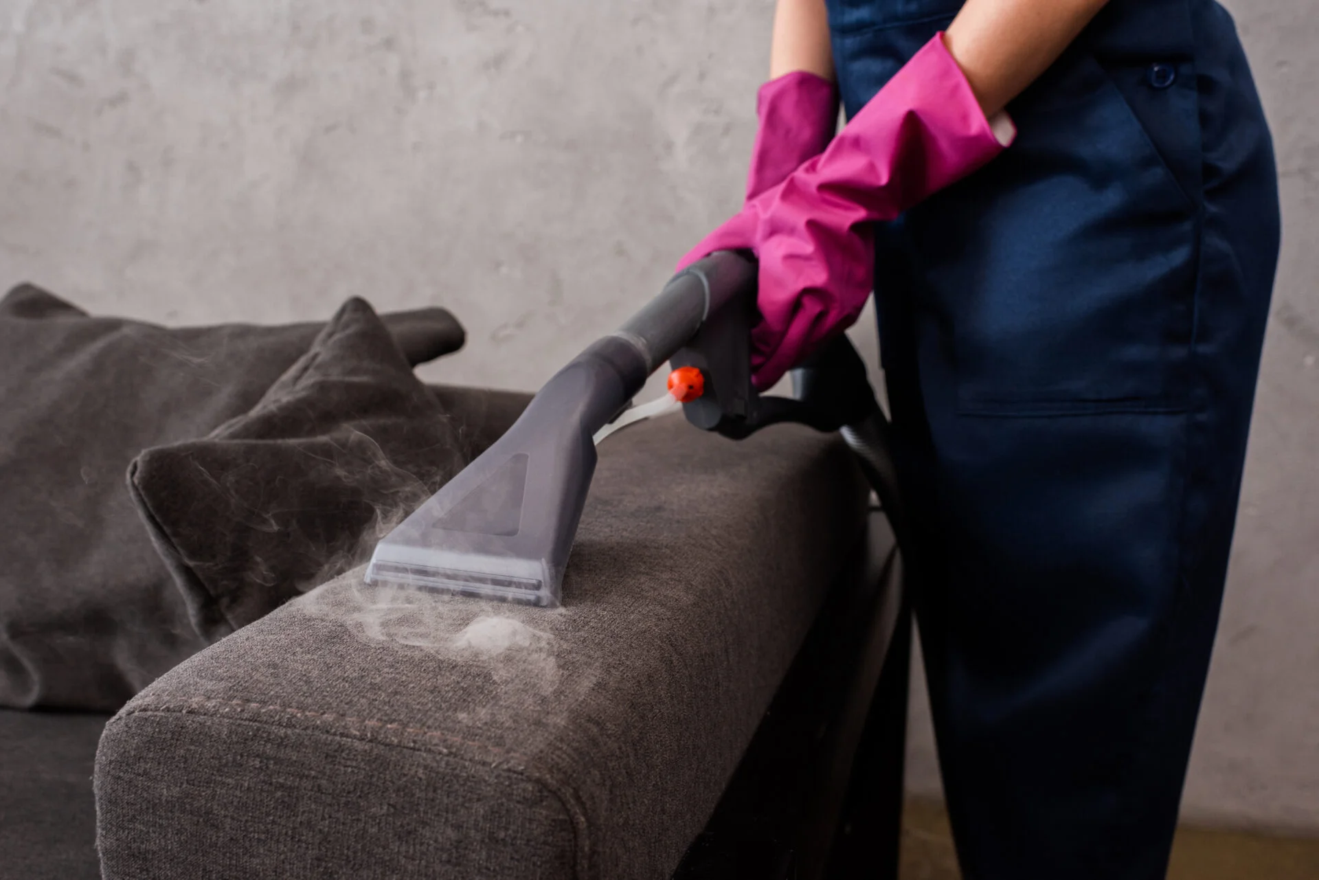 Woman cleaner her upholstery with non-toxic cleaner