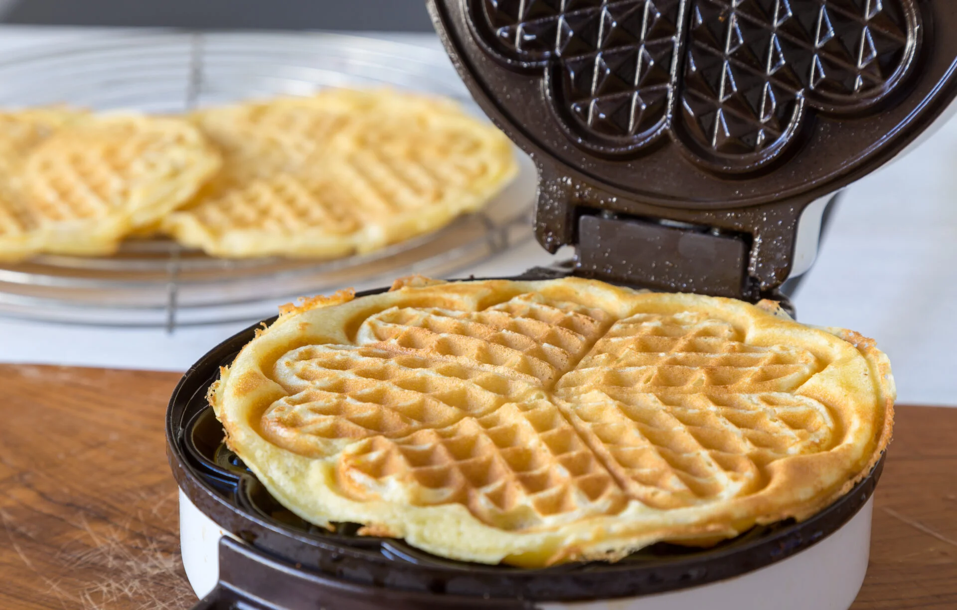 Homemade waffles are cooked in a non-toxic waffle iron