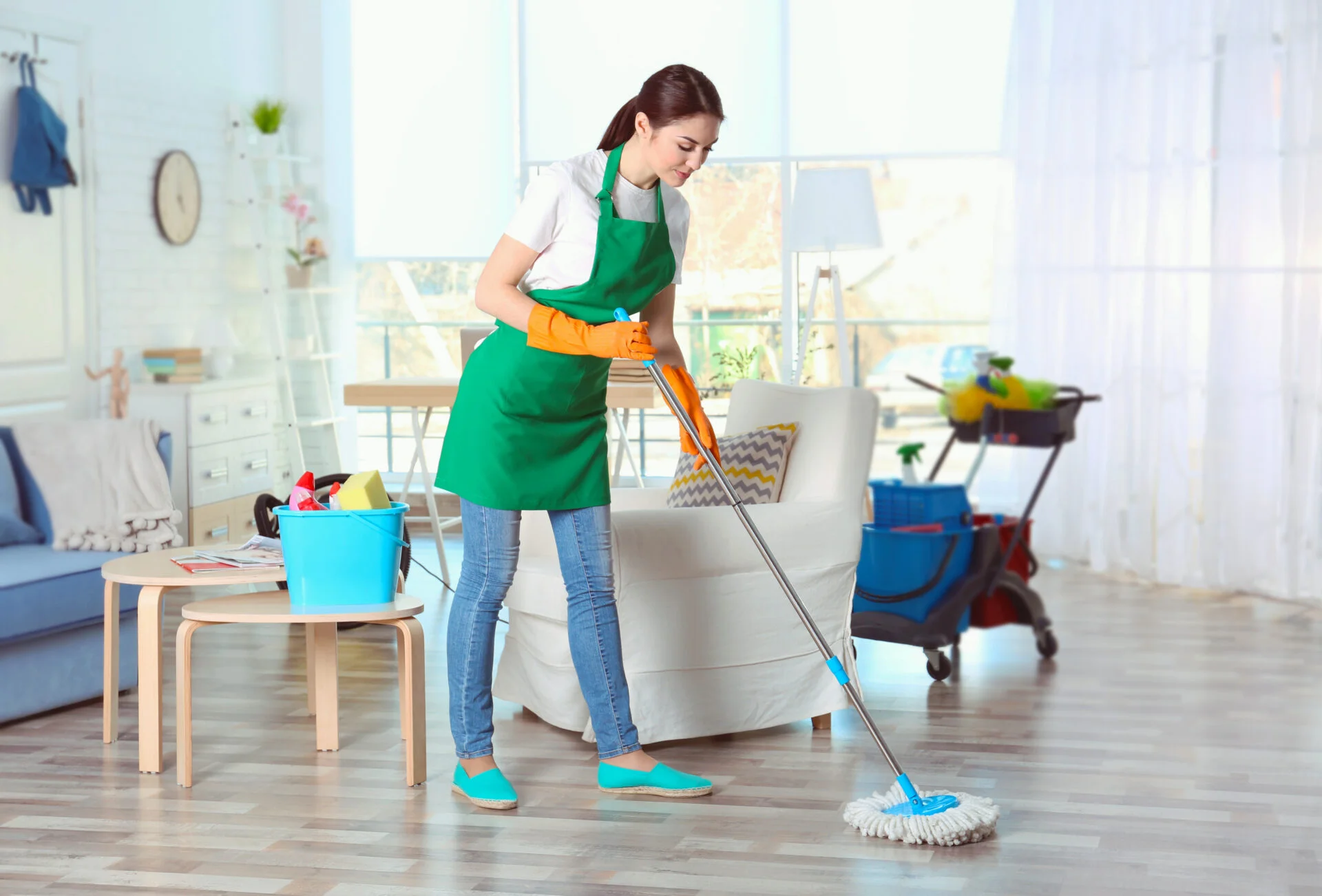 young women cleaning her wood floors with non-toxic floor cleaner