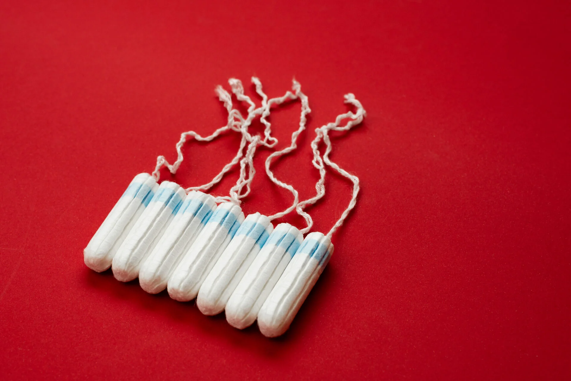 Tampons isolated on red background