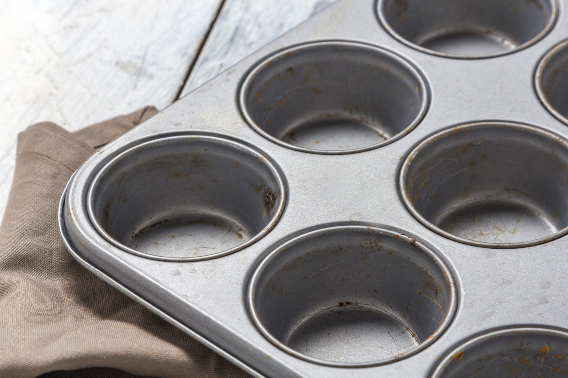 Muffin baking tray on a rustic wooden table