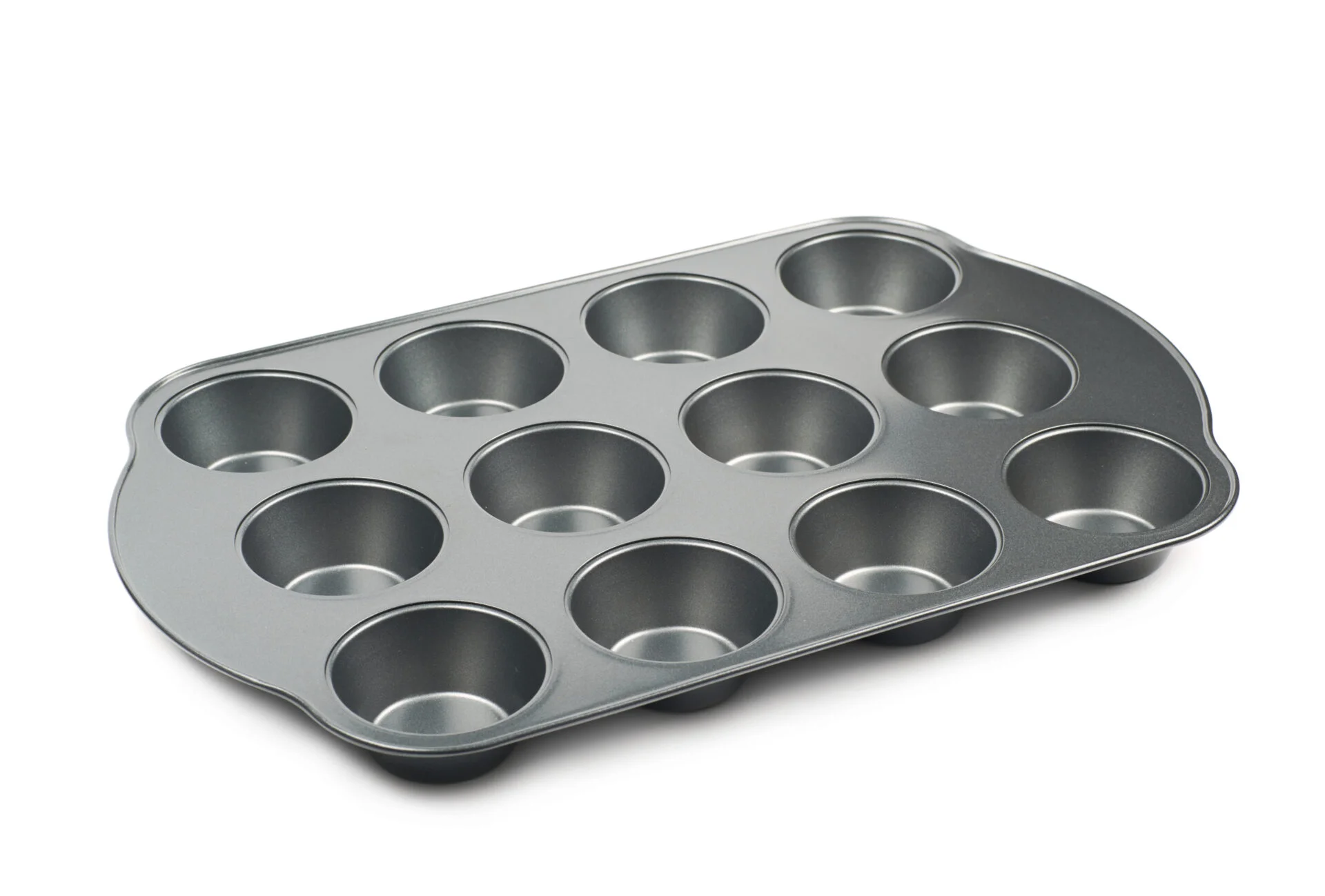 Metal muffin cupcake tray pan isolated over the white background