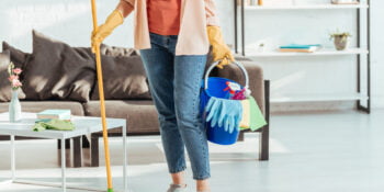 Woman cleaning home with non-toxic products