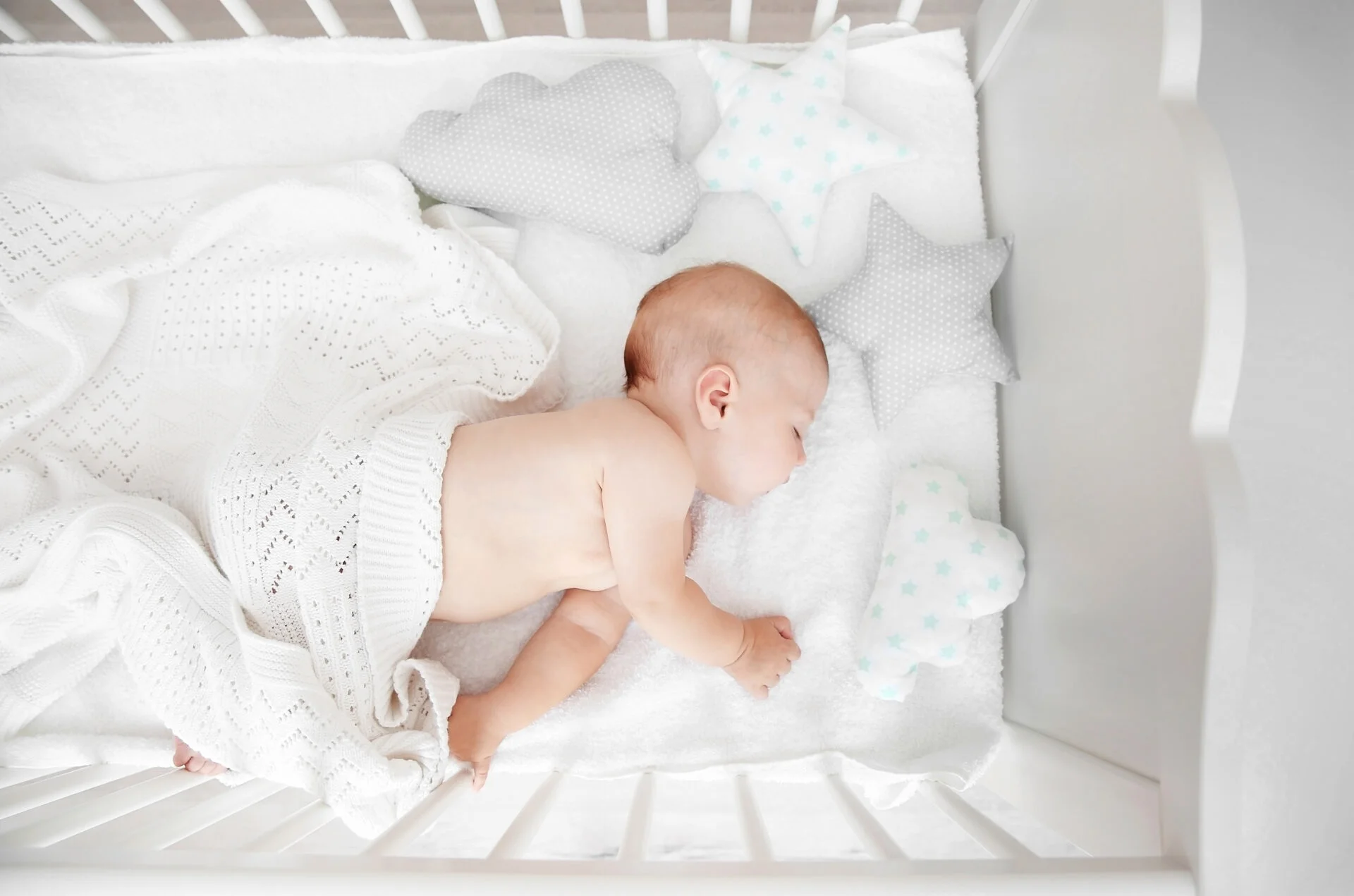 Baby sleeping on toxic Nook Pure Organic crib mattress full of PFAS "forever chemicals" 