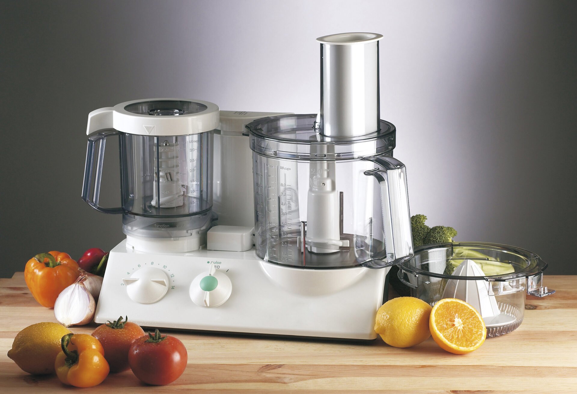 food blender with fruit and vegetable around